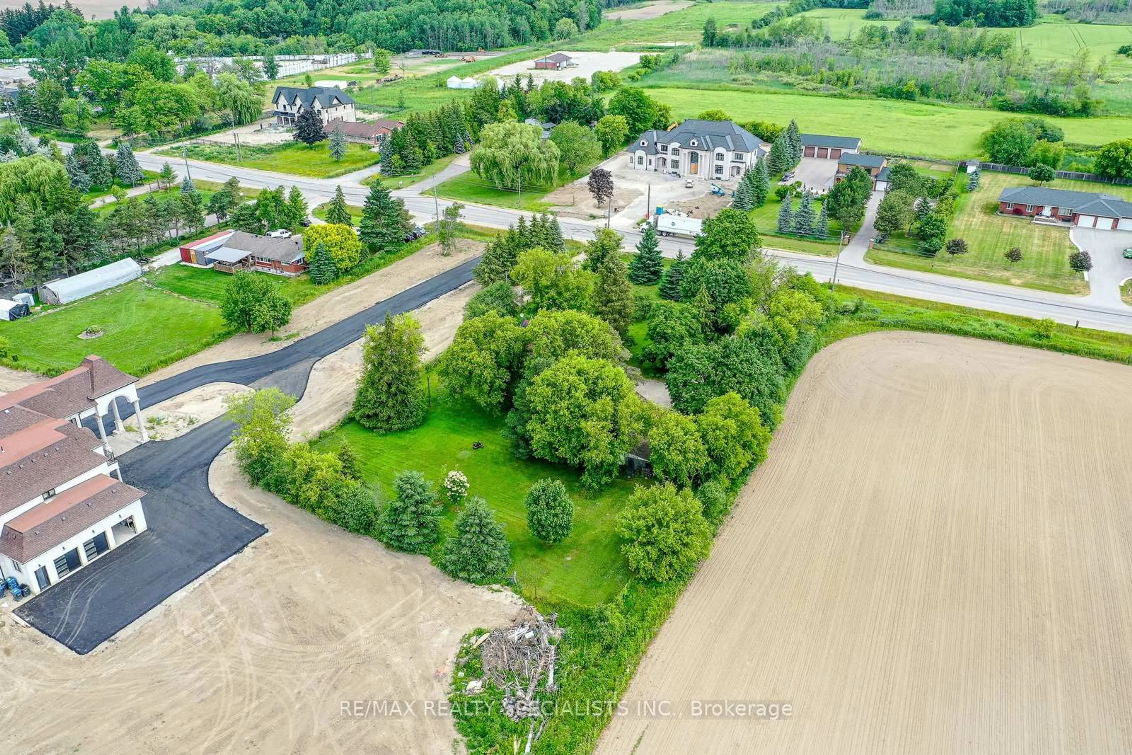 A pic from outside/outdoor area/front of a property/back of a property/a pic from drone, water/lake/river/ocean view for 15208 Airport Rd, Caledon Ontario L7C 2W7
