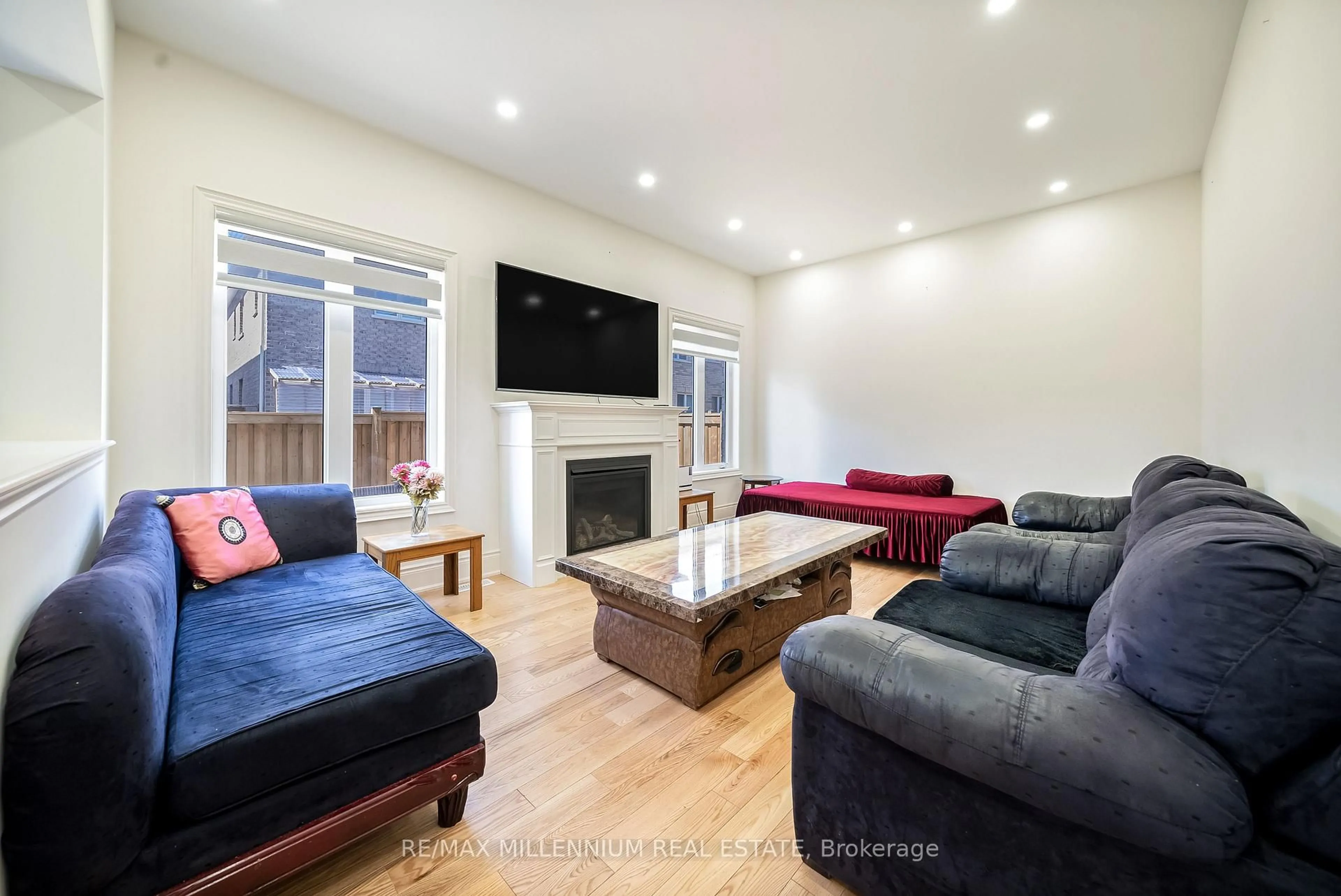 Living room with furniture, wood/laminate floor for 52 Elverton Cres, Brampton Ontario L7A 4Z4