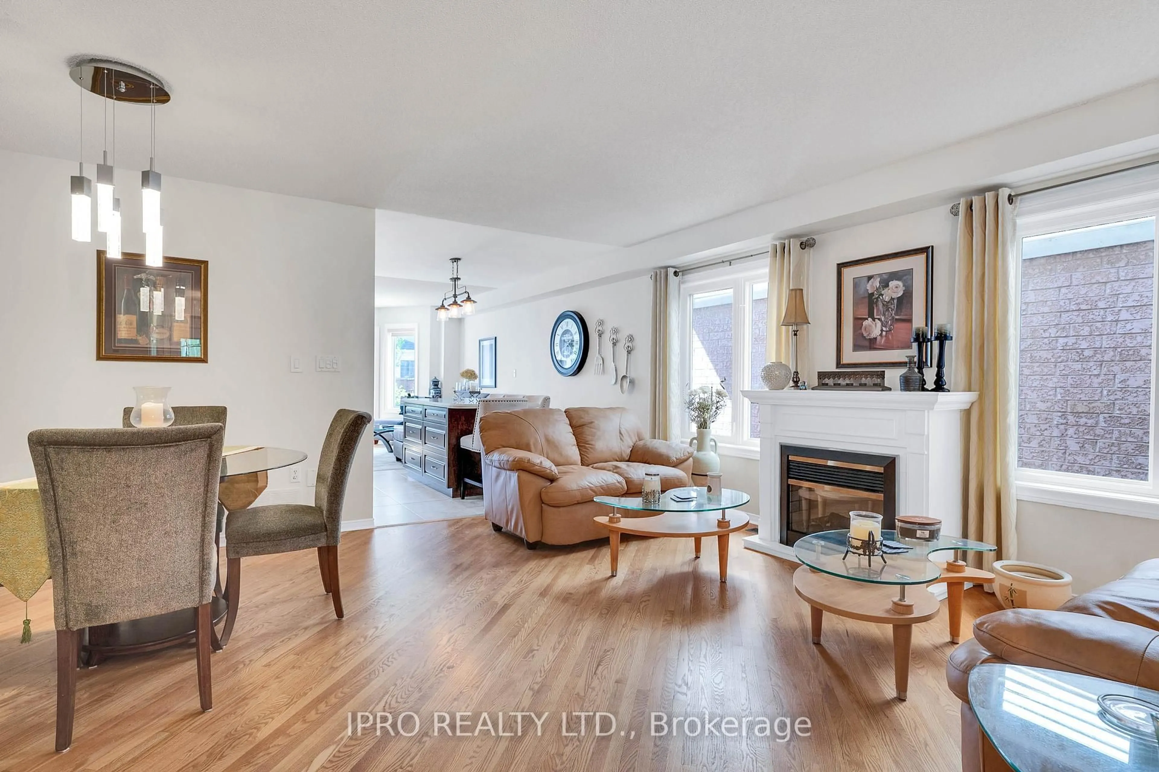Living room with furniture, wood/laminate floor for 12 Forestgrove Circ, Brampton Ontario L6Z 4T2