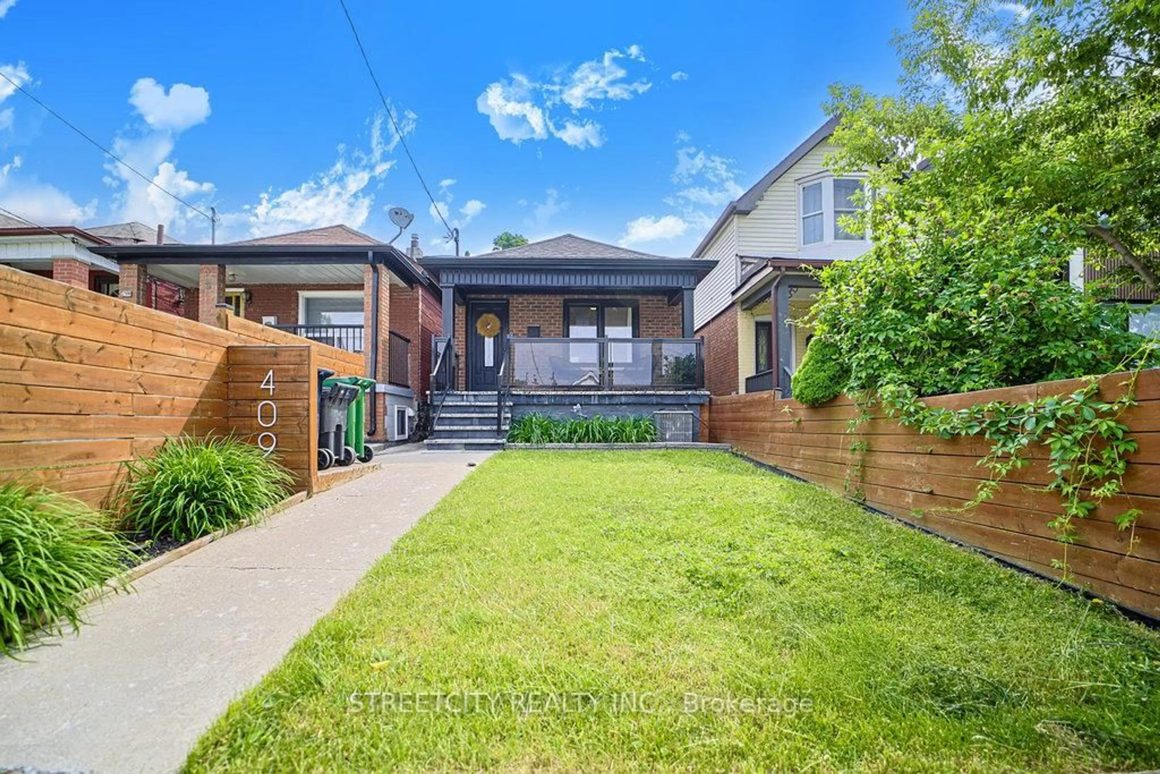 Home with brick exterior material, street for 409 Mcroberts Ave, Toronto Ontario M6E 4R1
