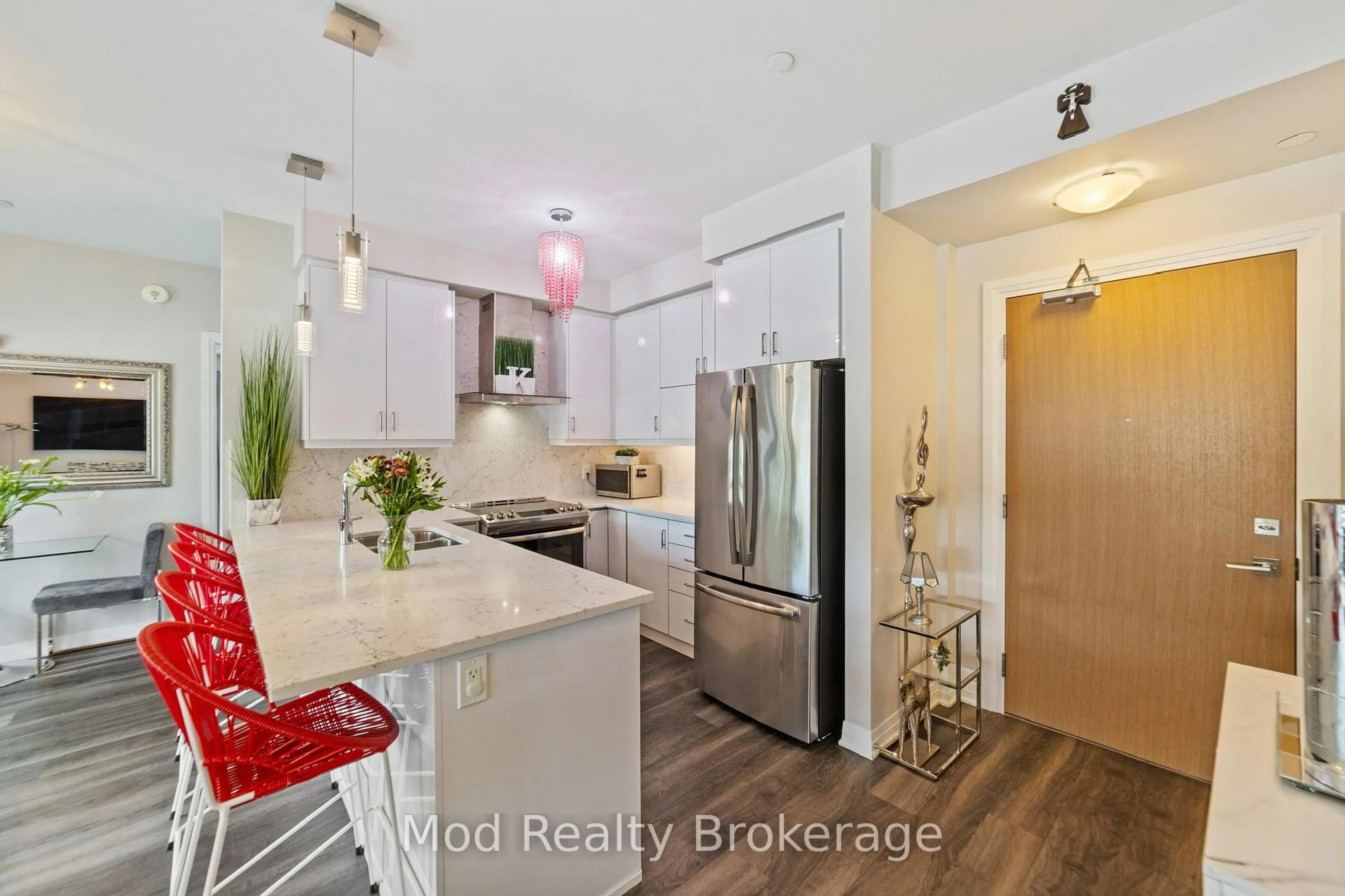 Open concept kitchen, wood/laminate floor for 128 Grovewood Common #129, Oakville Ontario L6H 0X3