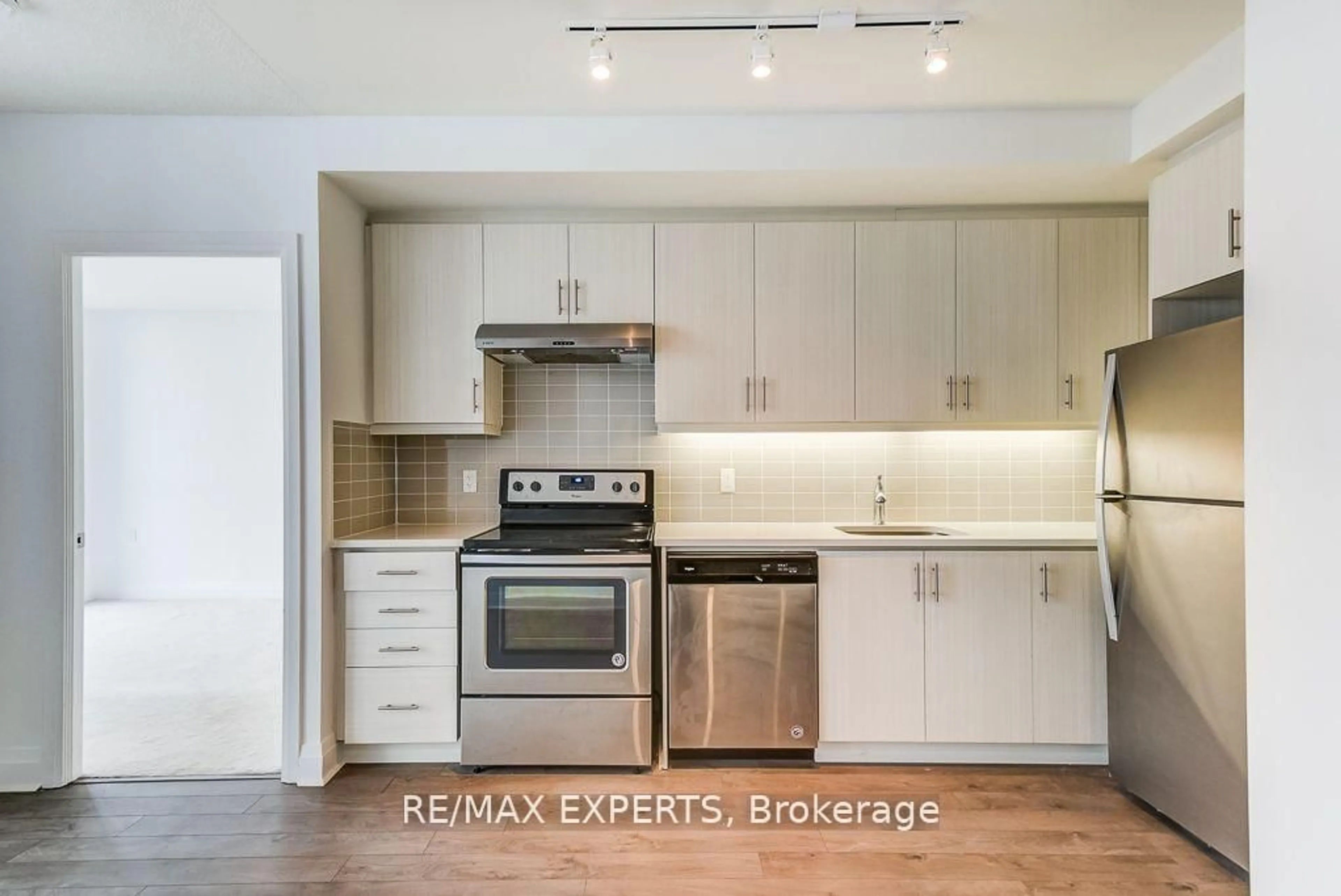 Open concept kitchen, wood/laminate floor for 17 Zorra St #2205, Toronto Ontario M8Z 4Z6