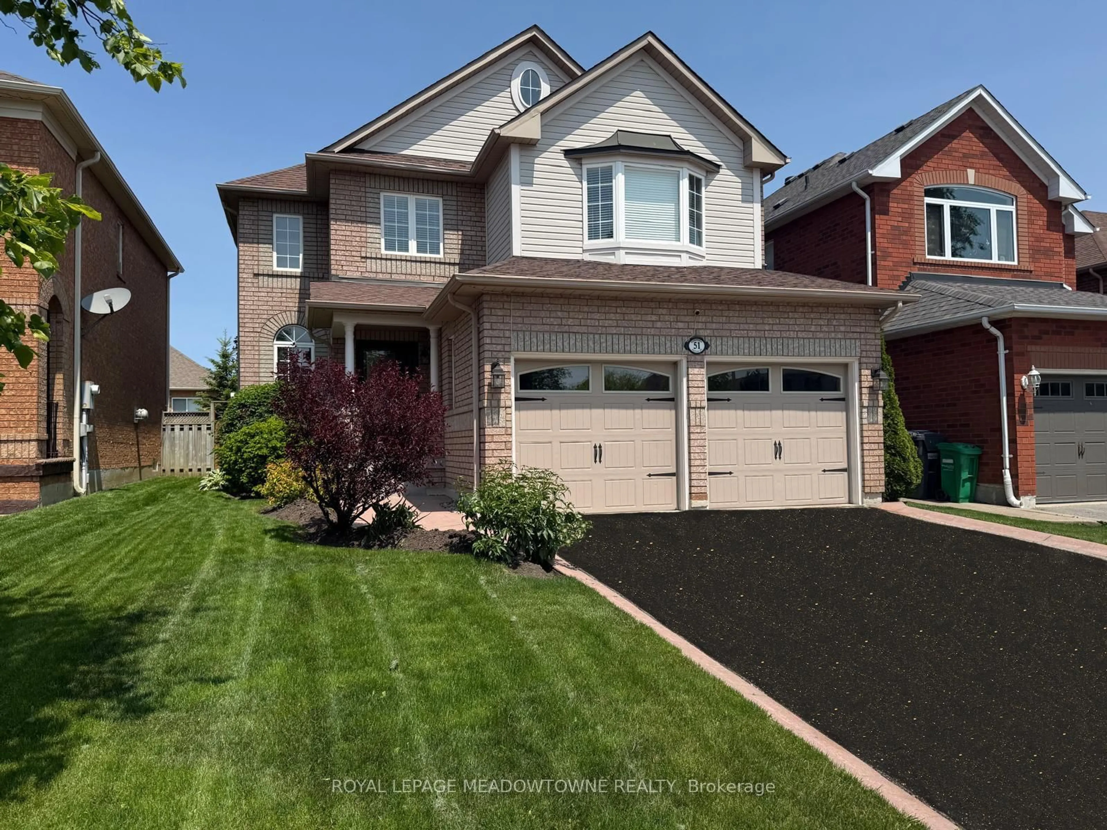 Home with vinyl exterior material, street for 51 Robertson Davies Dr, Brampton Ontario L7A 1K3