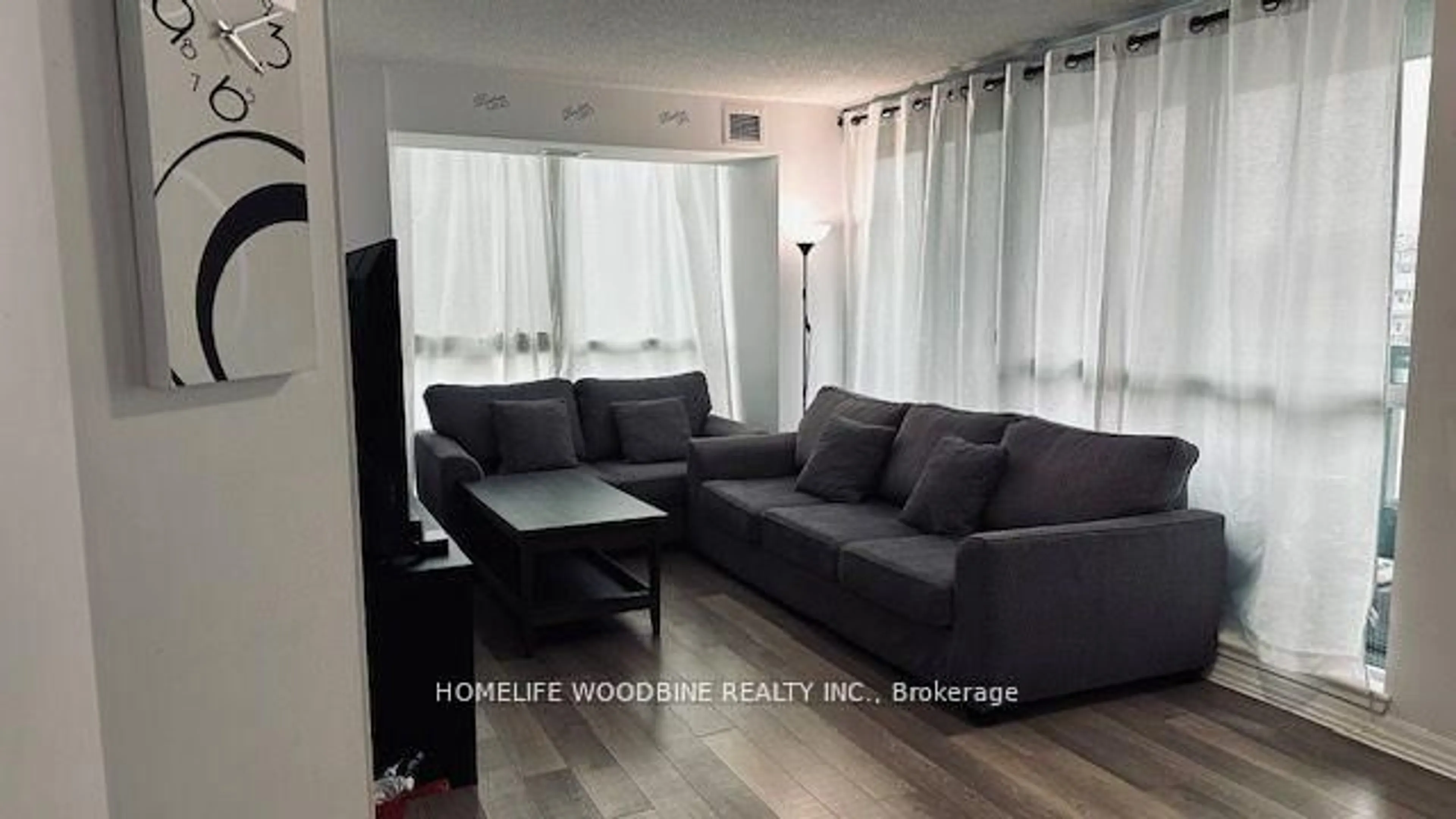 Living room with furniture, wood/laminate floor for 80 Esther Lorrie Dr #312, Toronto Ontario M9W 0C6