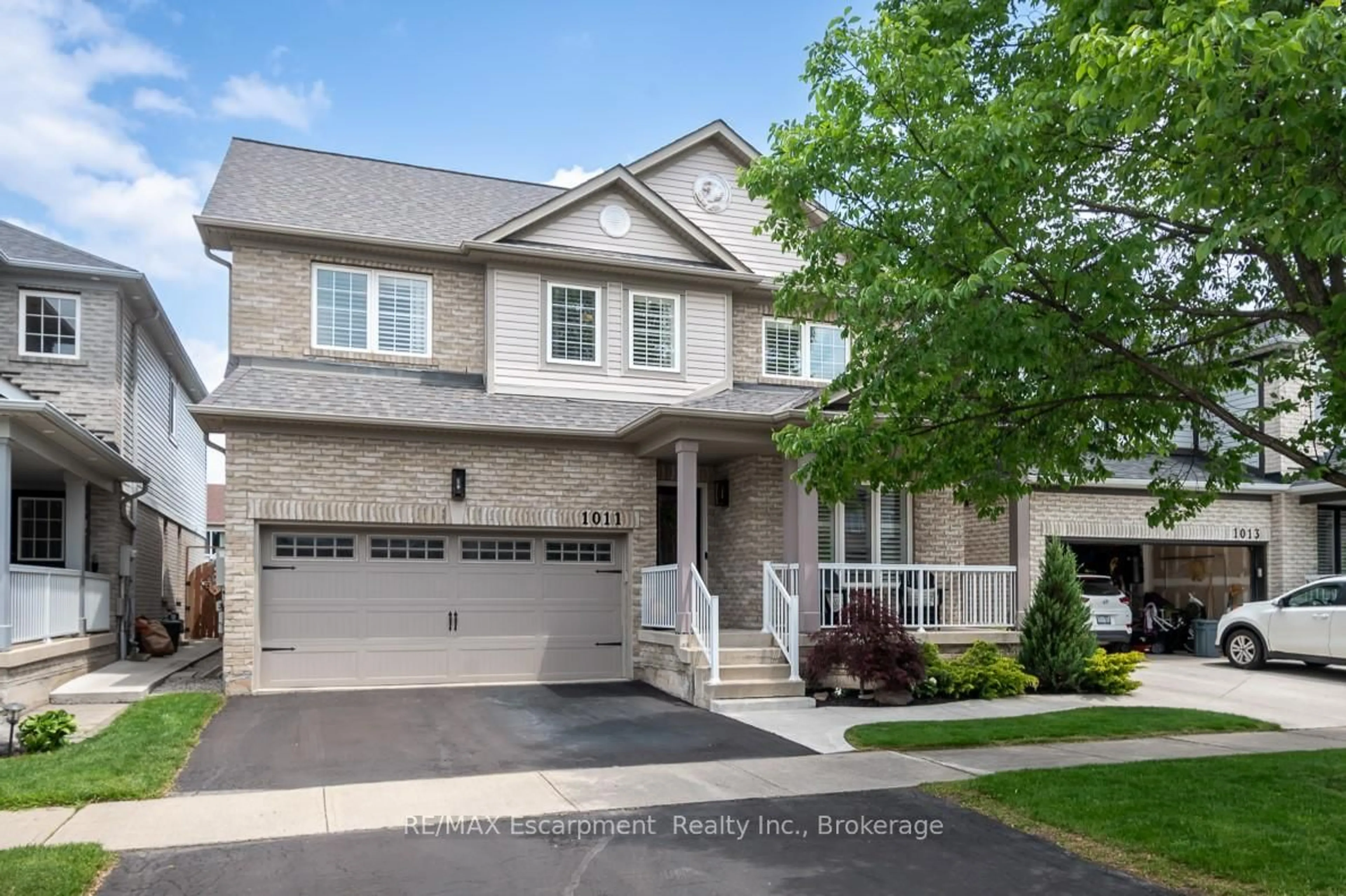 Home with brick exterior material, street for 1011 Vickerman Way, Milton Ontario L9T 0B9