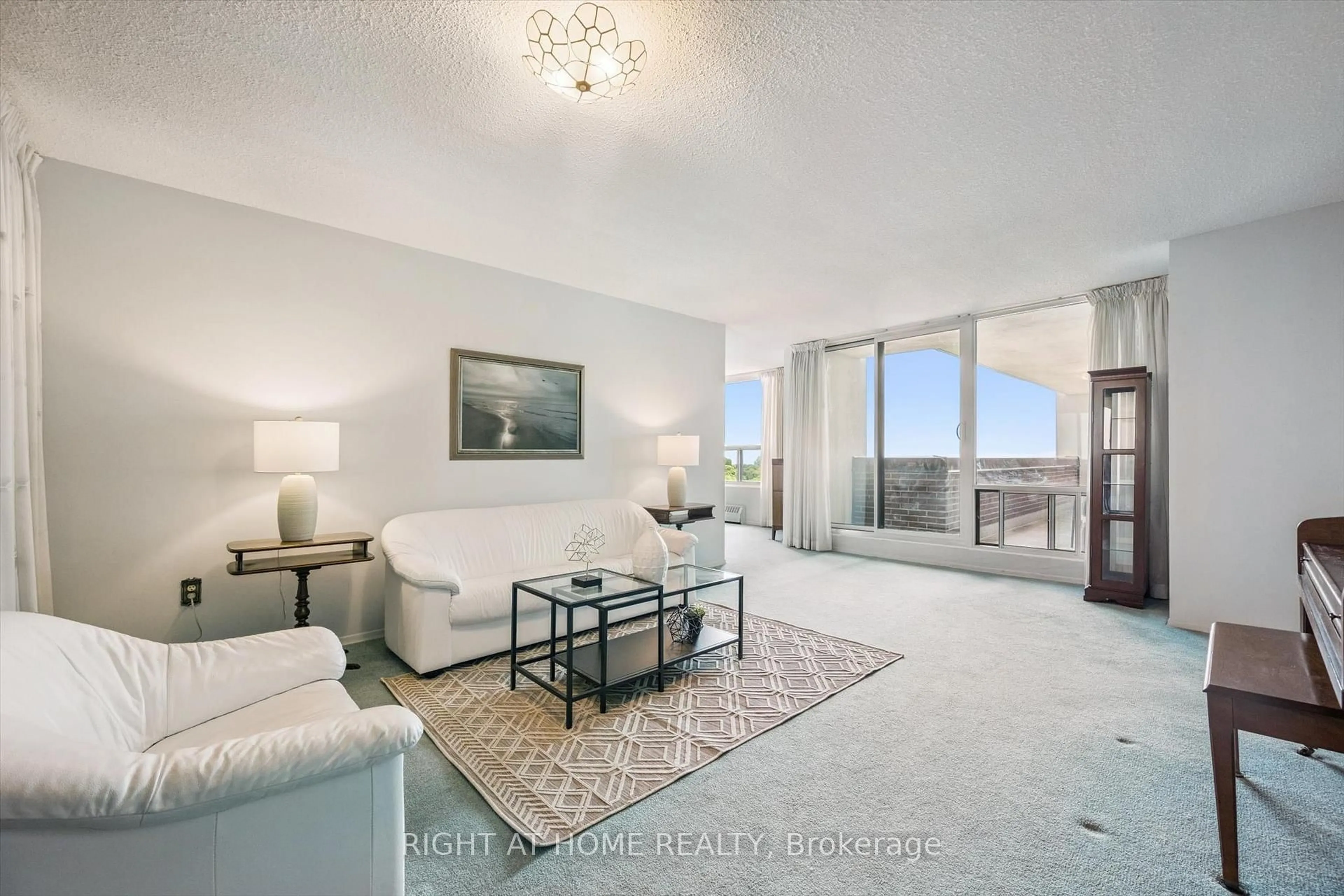Living room with furniture, unknown for 1515 Lakeshore Rd #802, Mississauga Ontario L5E 3E3