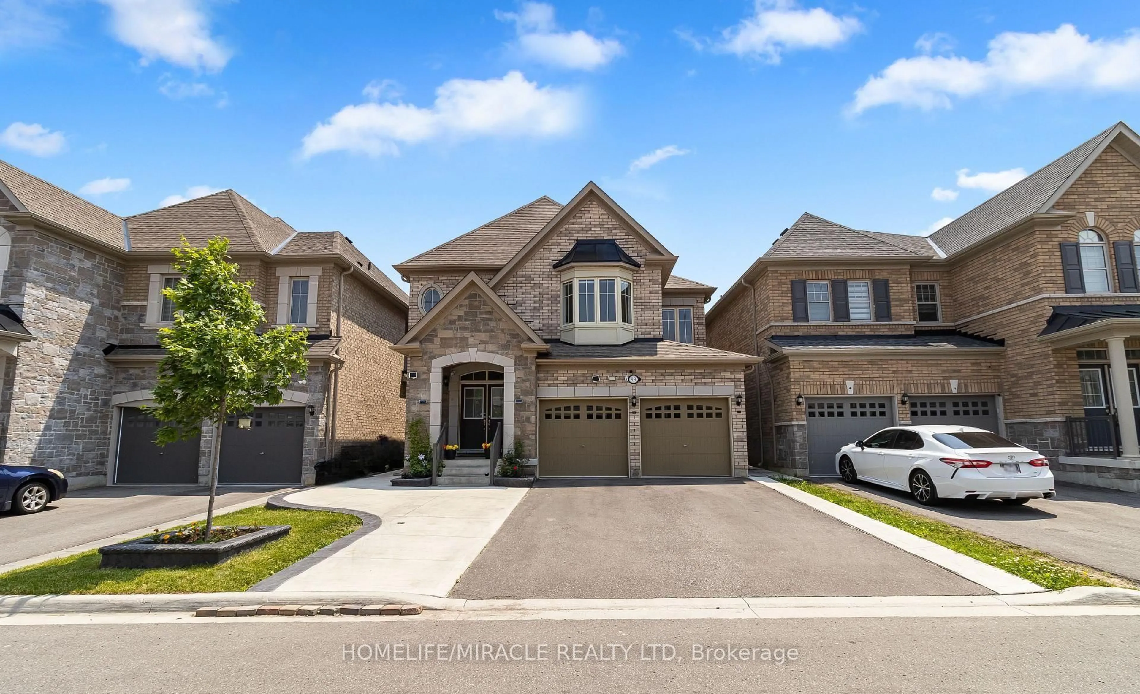 Home with brick exterior material, street for 99 Benhurst Cres, Brampton Ontario L7A 5A4