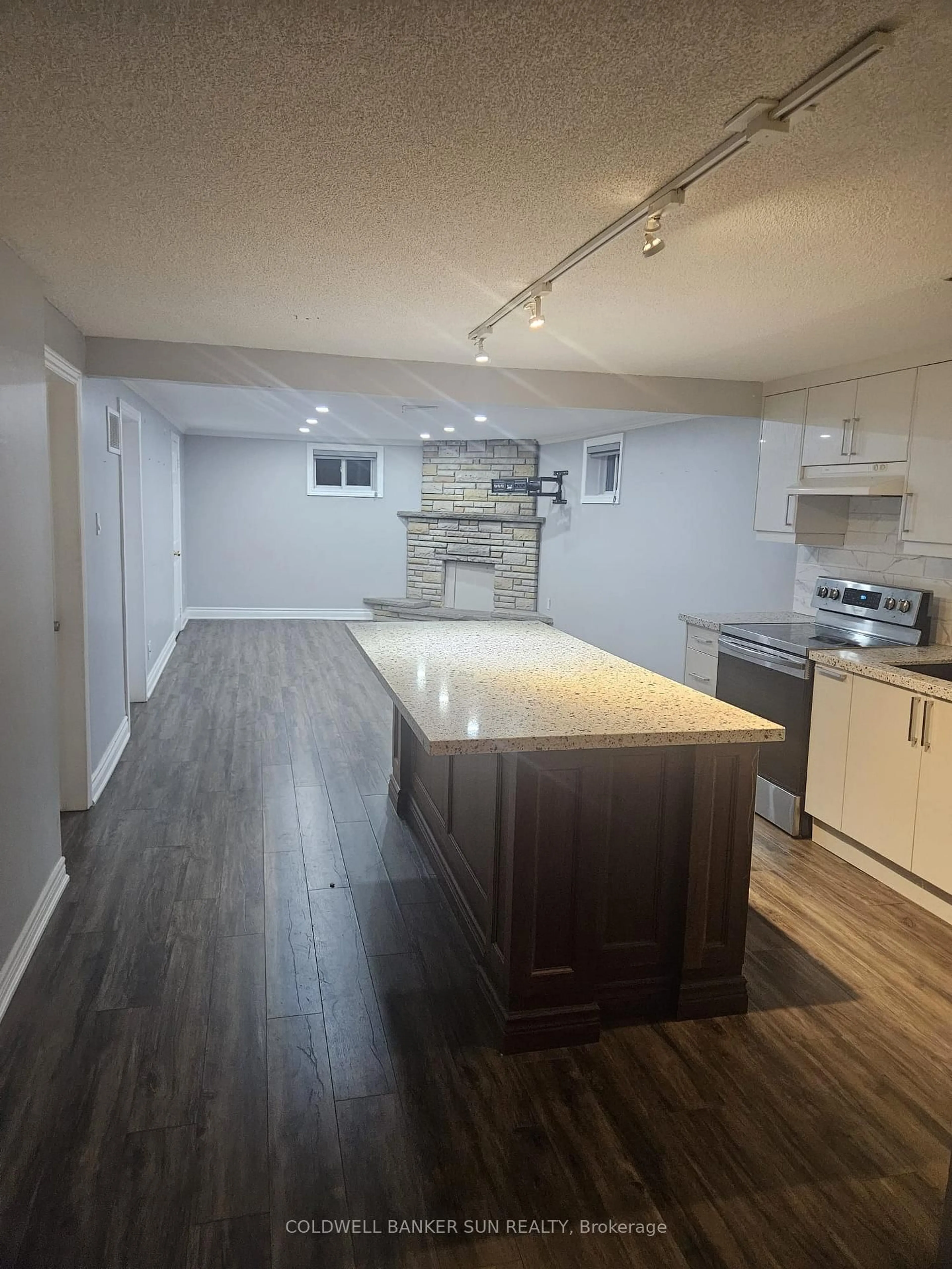 Open concept kitchen, wood/laminate floor for 104 Abell Dr, Brampton Ontario L6V 2Z8