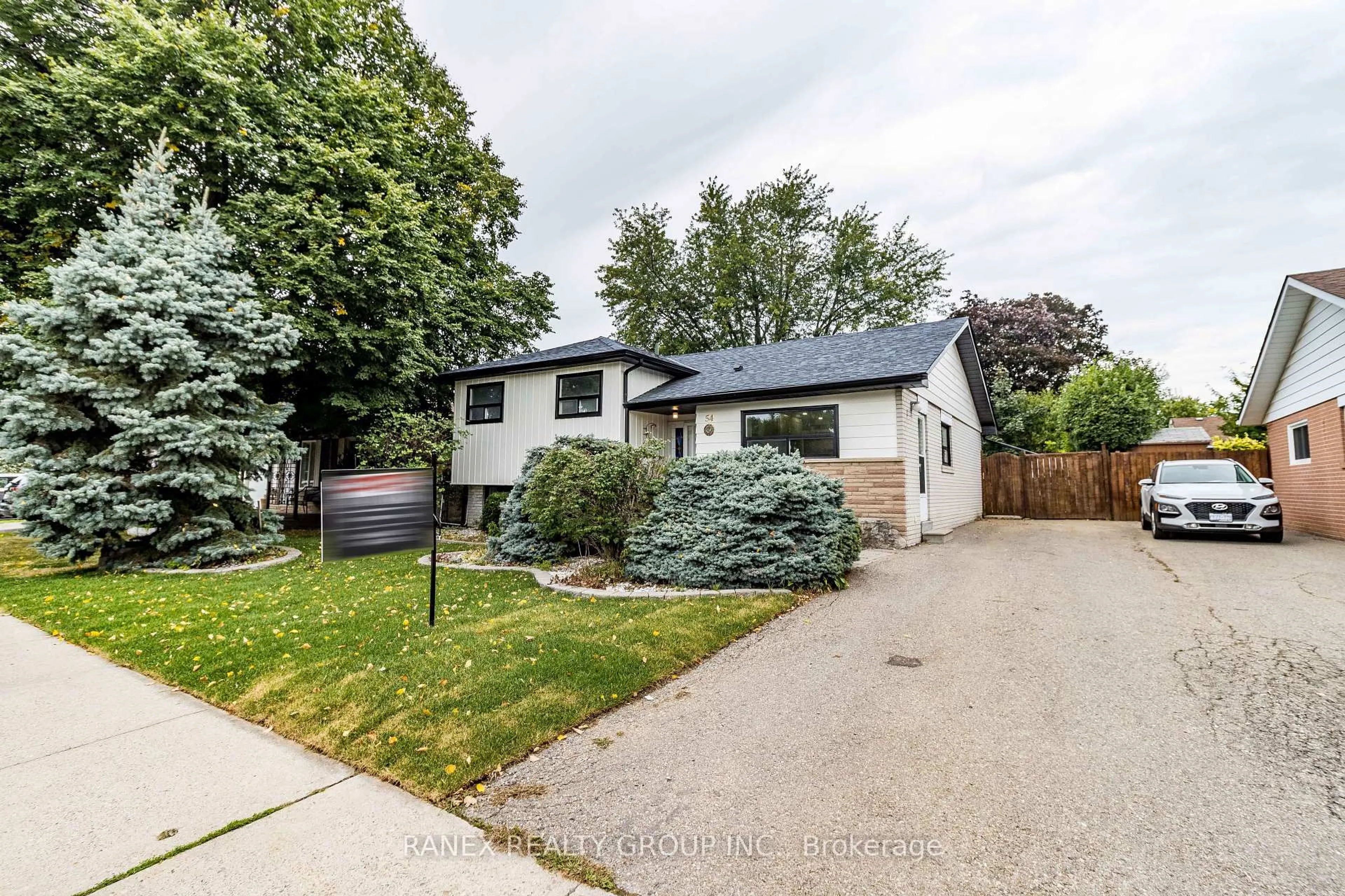Home with vinyl exterior material, street for 54 Flowertown Ave, Brampton Ontario L6X 2K7