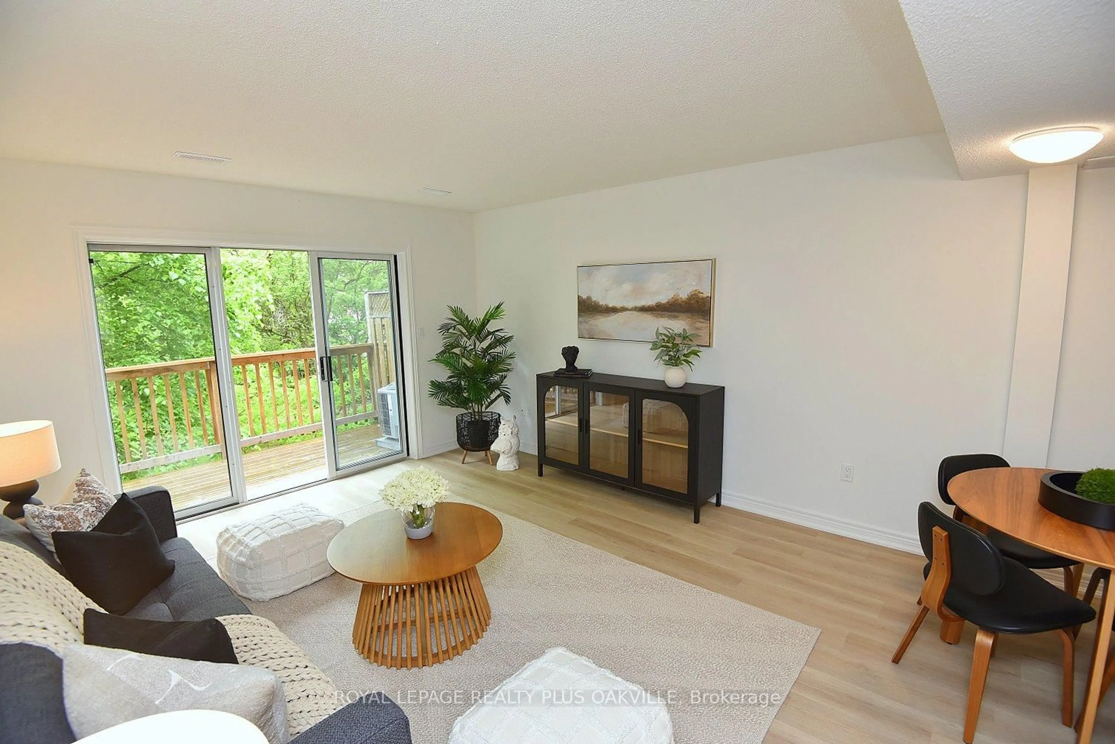 Living room with furniture, wood/laminate floor for 4045 Upper Middle Rd #14, Burlington Ontario L7M 4S8