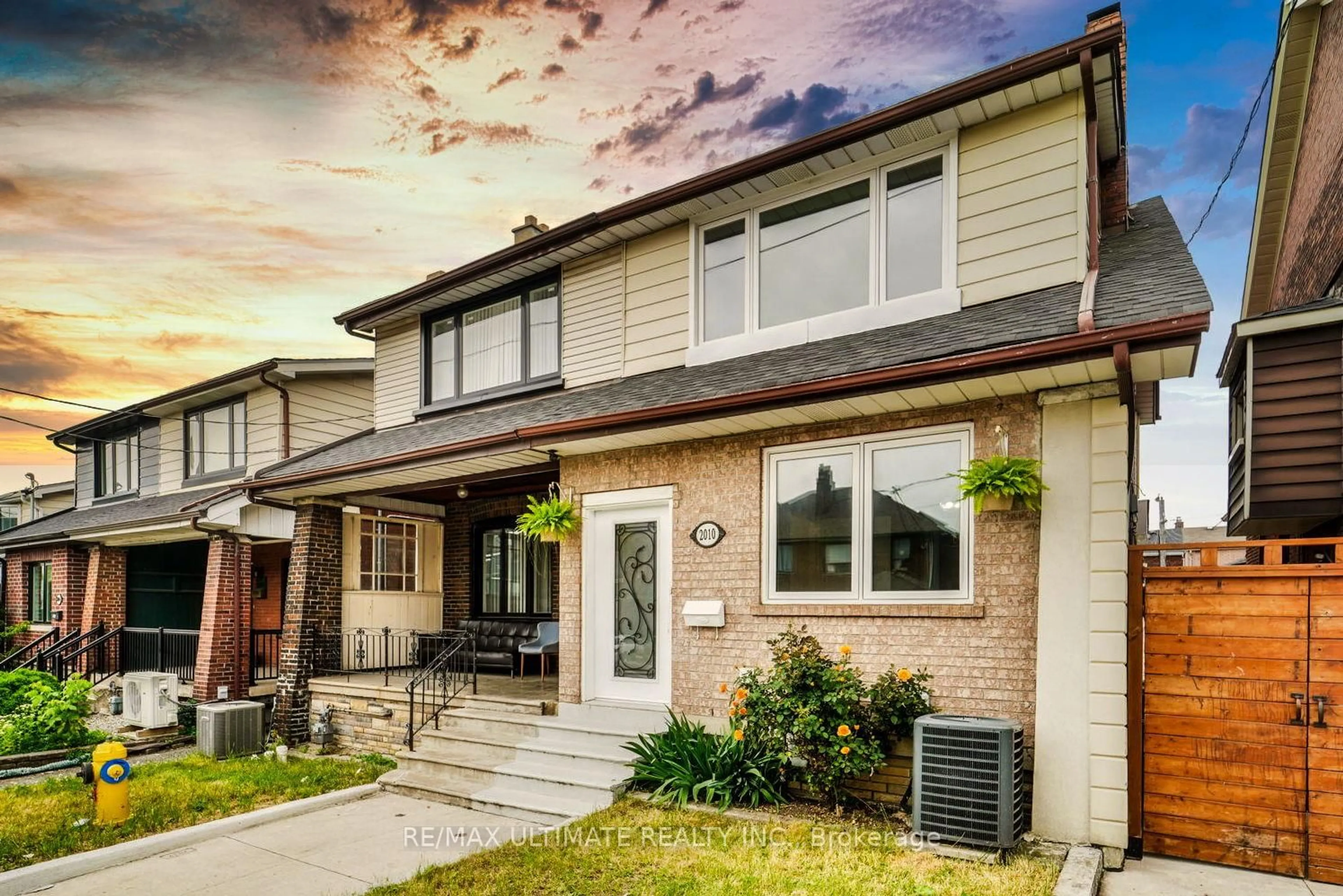 Home with vinyl exterior material, street for 2010 Dufferin St, Toronto Ontario M6E 3R2