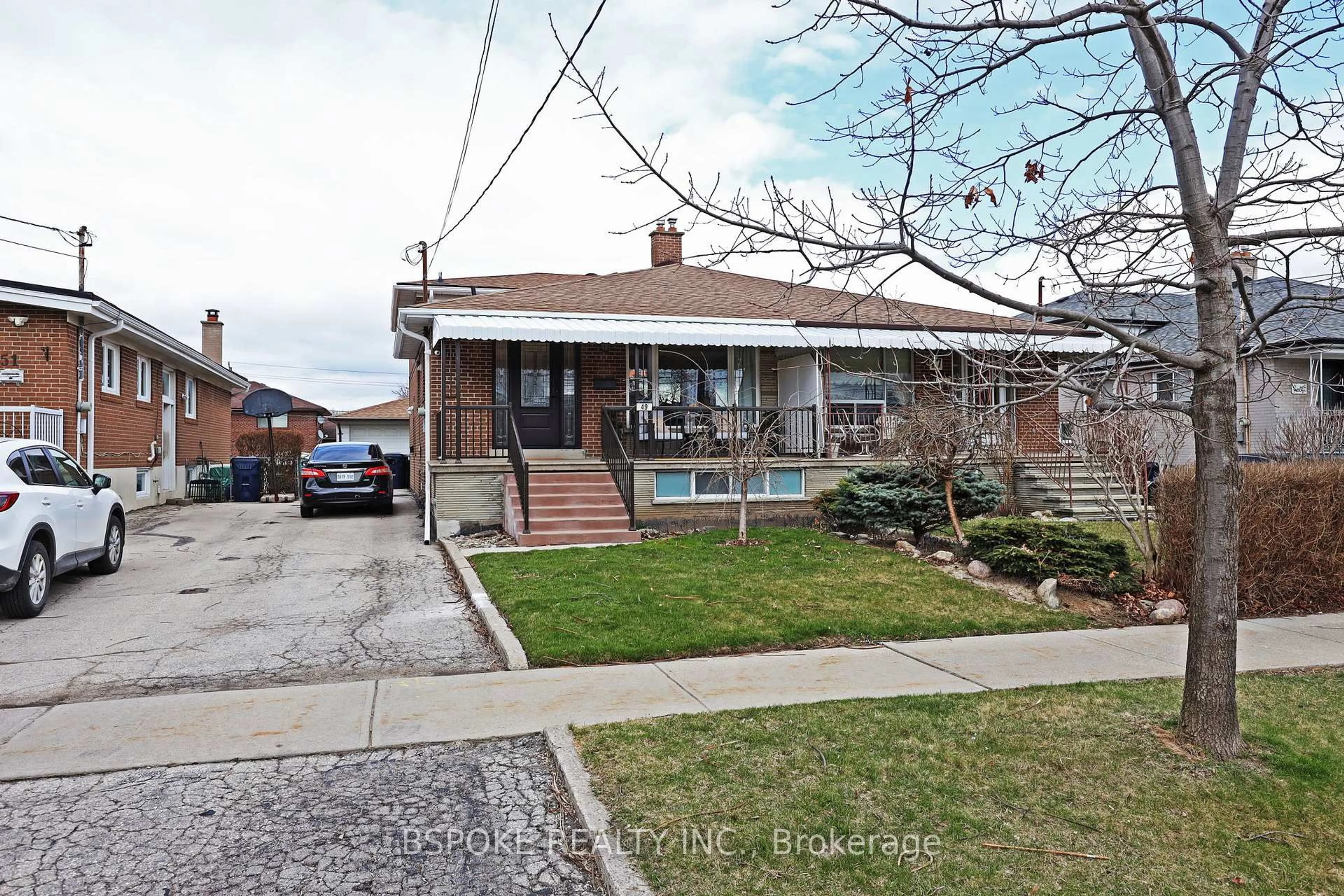 Home with brick exterior material, street for 49 Howbert Dr, Toronto Ontario M9N 3L1