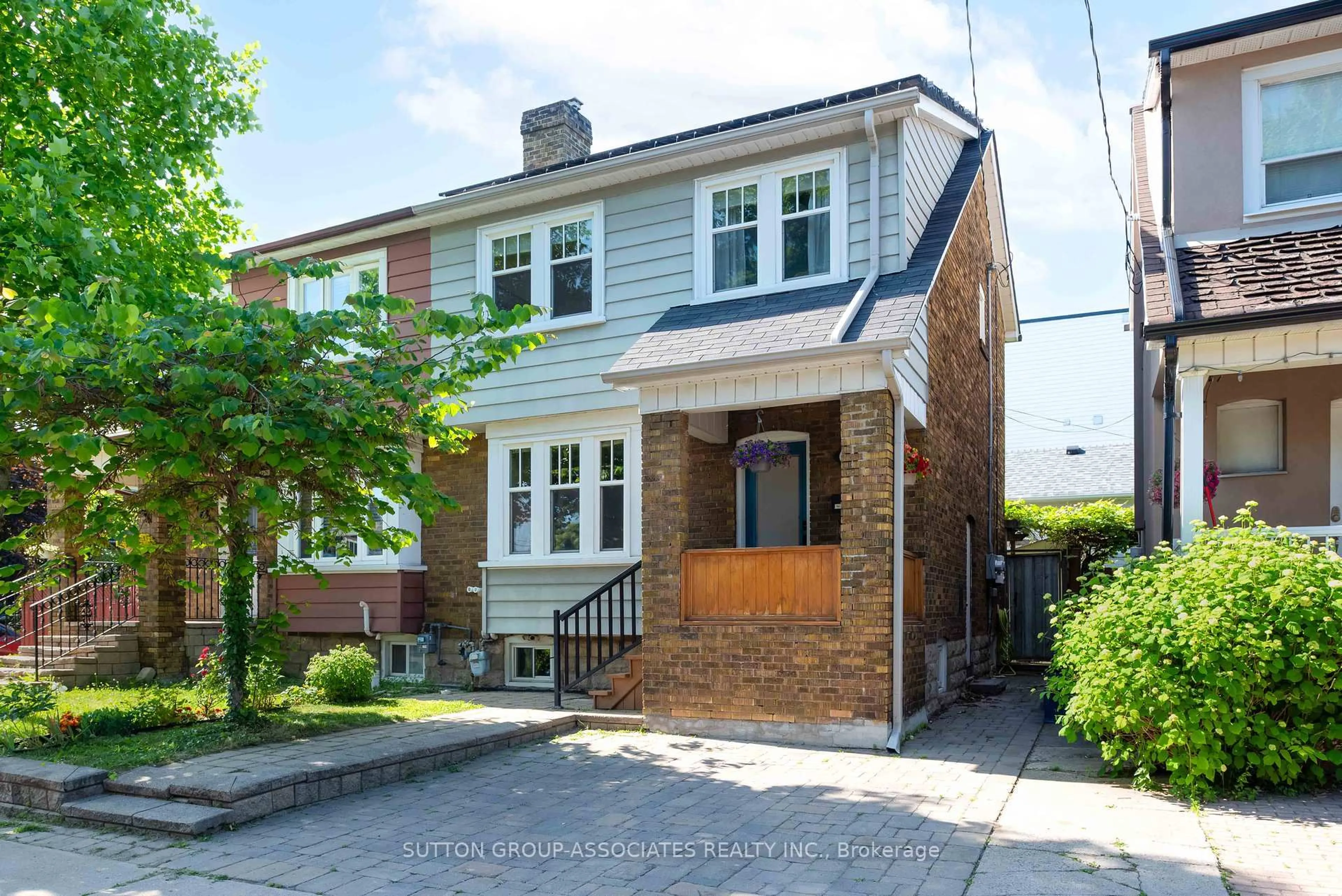 Home with brick exterior material, street for 70 Goodwood Ave, Toronto Ontario M6E 1J3