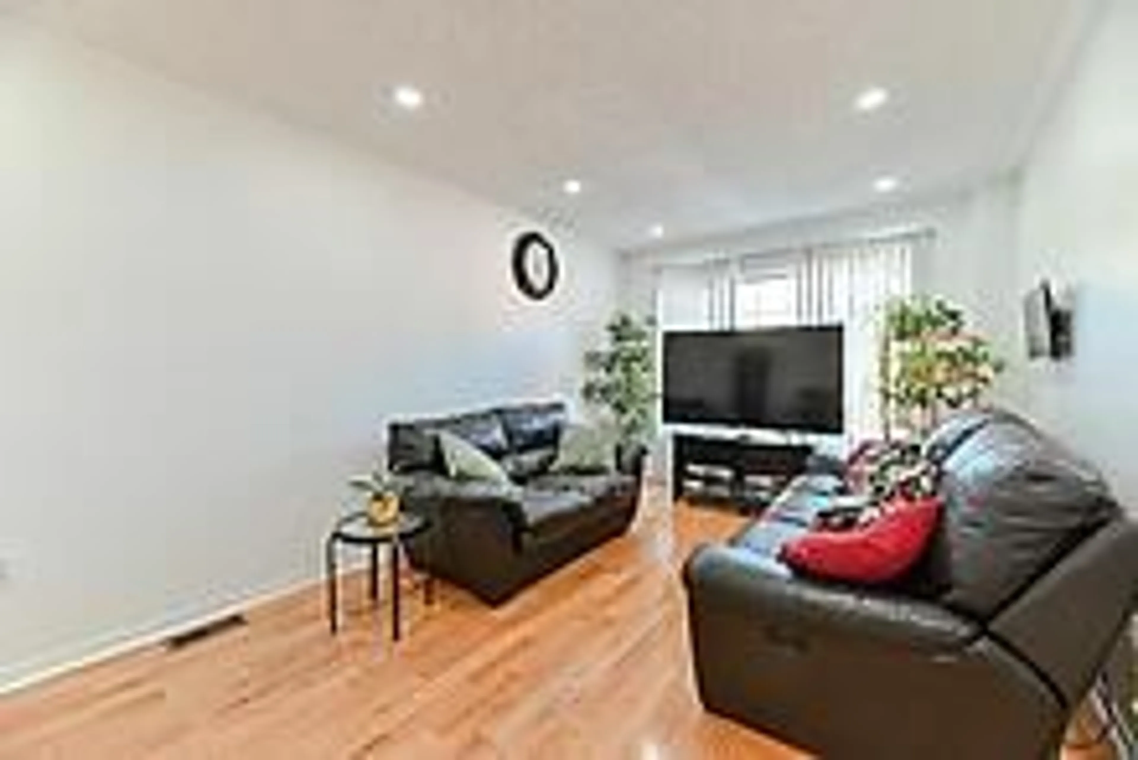 Living room with furniture, wood/laminate floor for 3020 Cedarglen Gate #35, Mississauga Ontario L5C 4S7