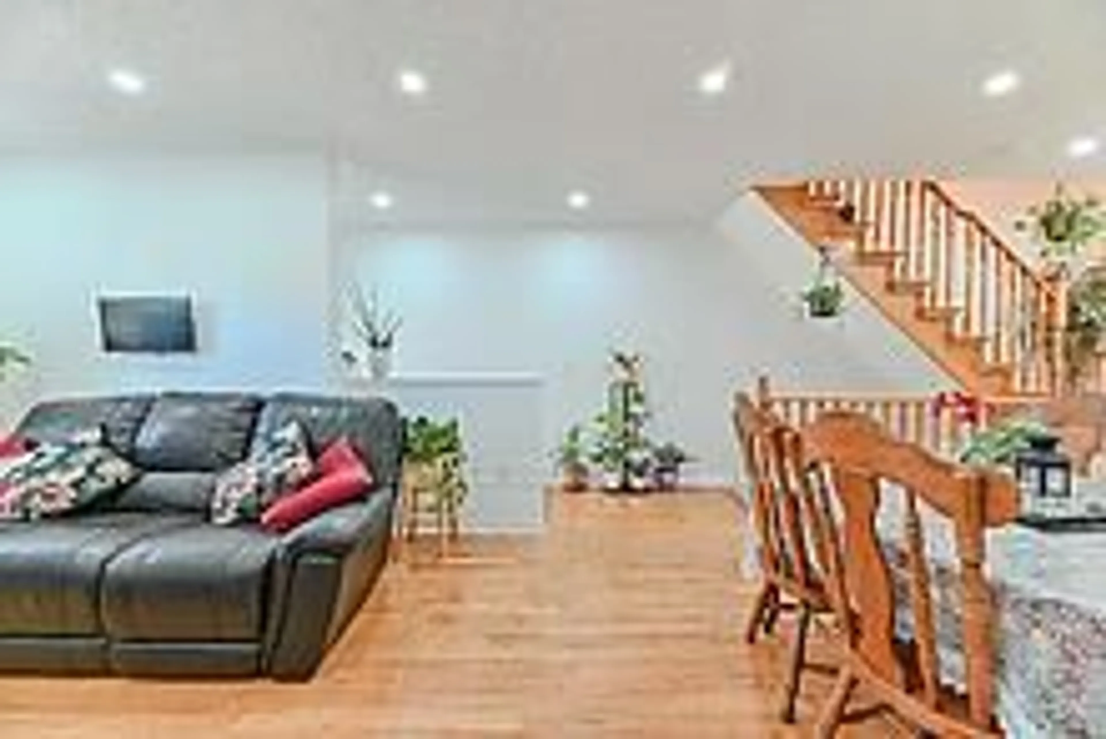Living room with furniture, wood/laminate floor for 3020 Cedarglen Gate #35, Mississauga Ontario L5C 4S7