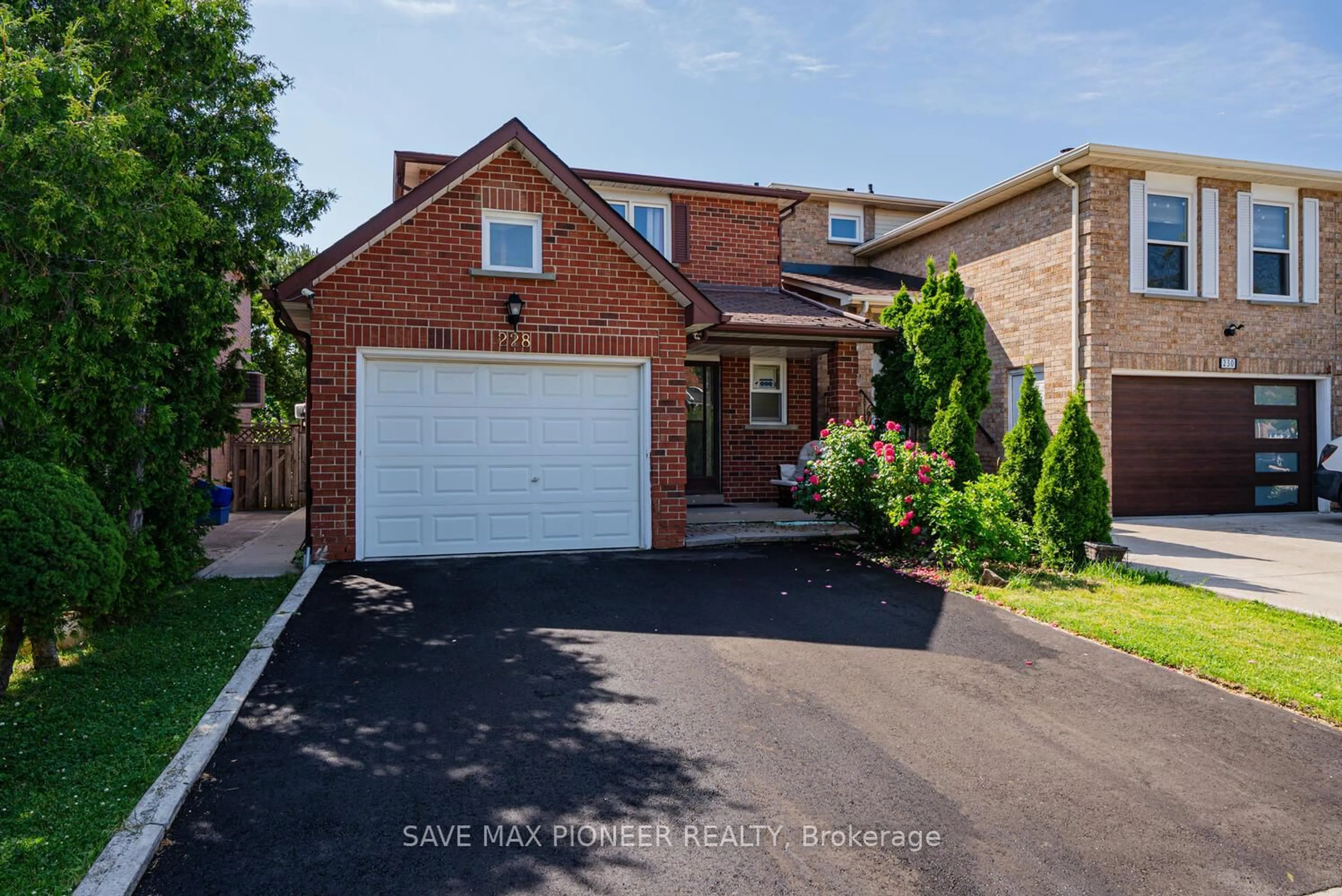 Home with brick exterior material, street for 228 Lech Walesa Dr, Mississauga Ontario L5B 3H6