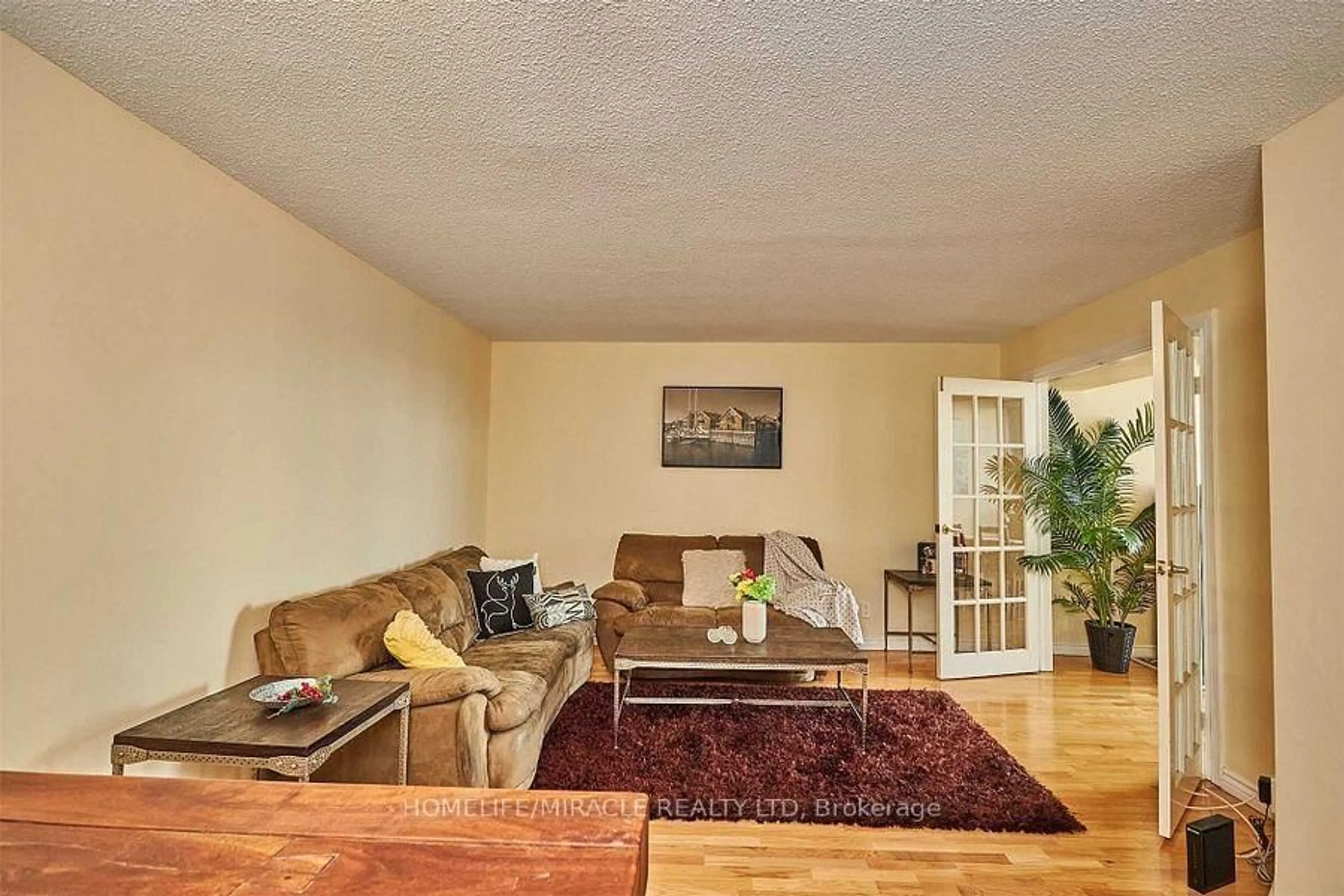 Living room with furniture, wood/laminate floor for 41 Markbrook Lane #1803, Toronto Ontario M9V 5E6