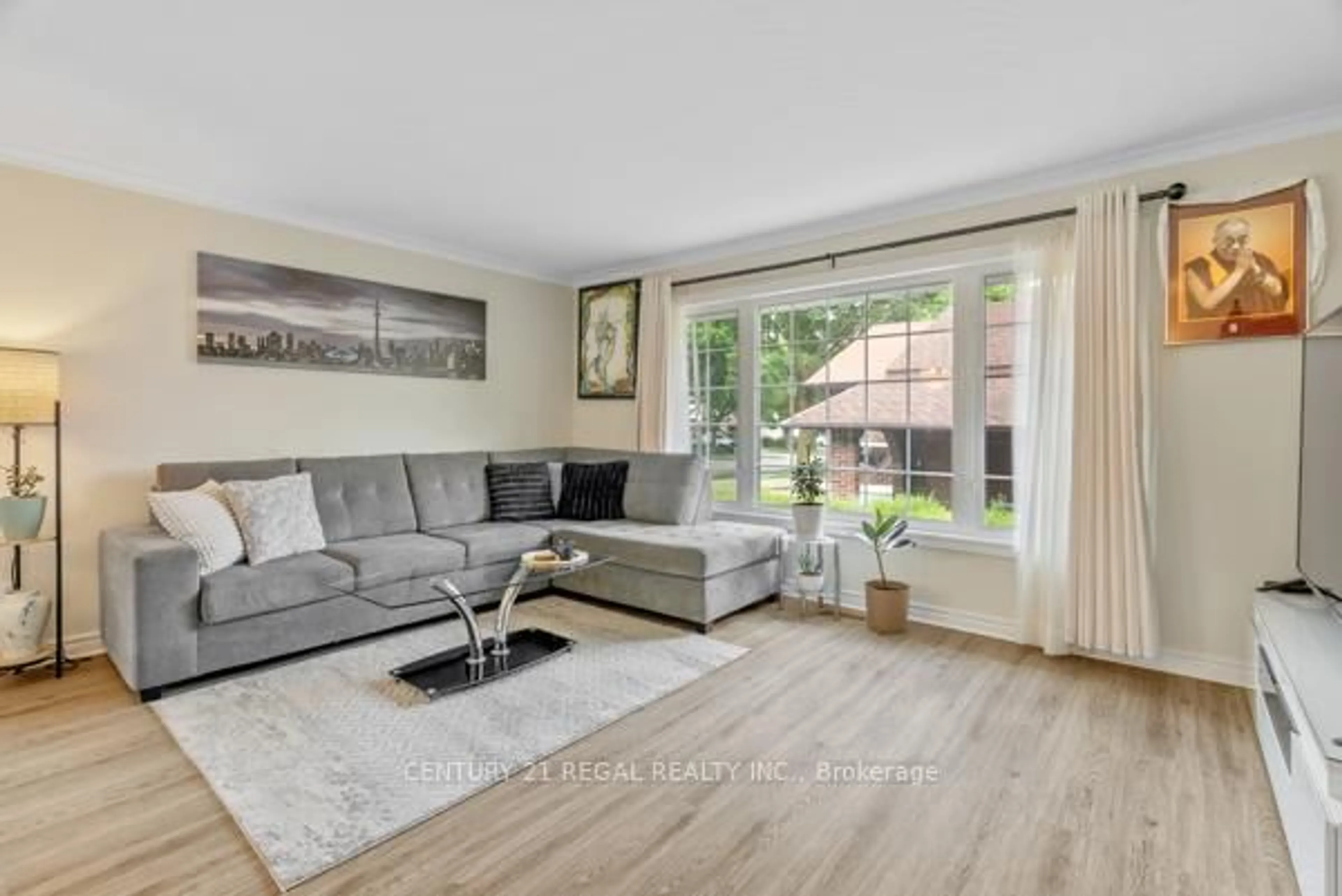 Living room with furniture, wood/laminate floor for 97 Westhampton Dr, Toronto Ontario M9R 1Y1