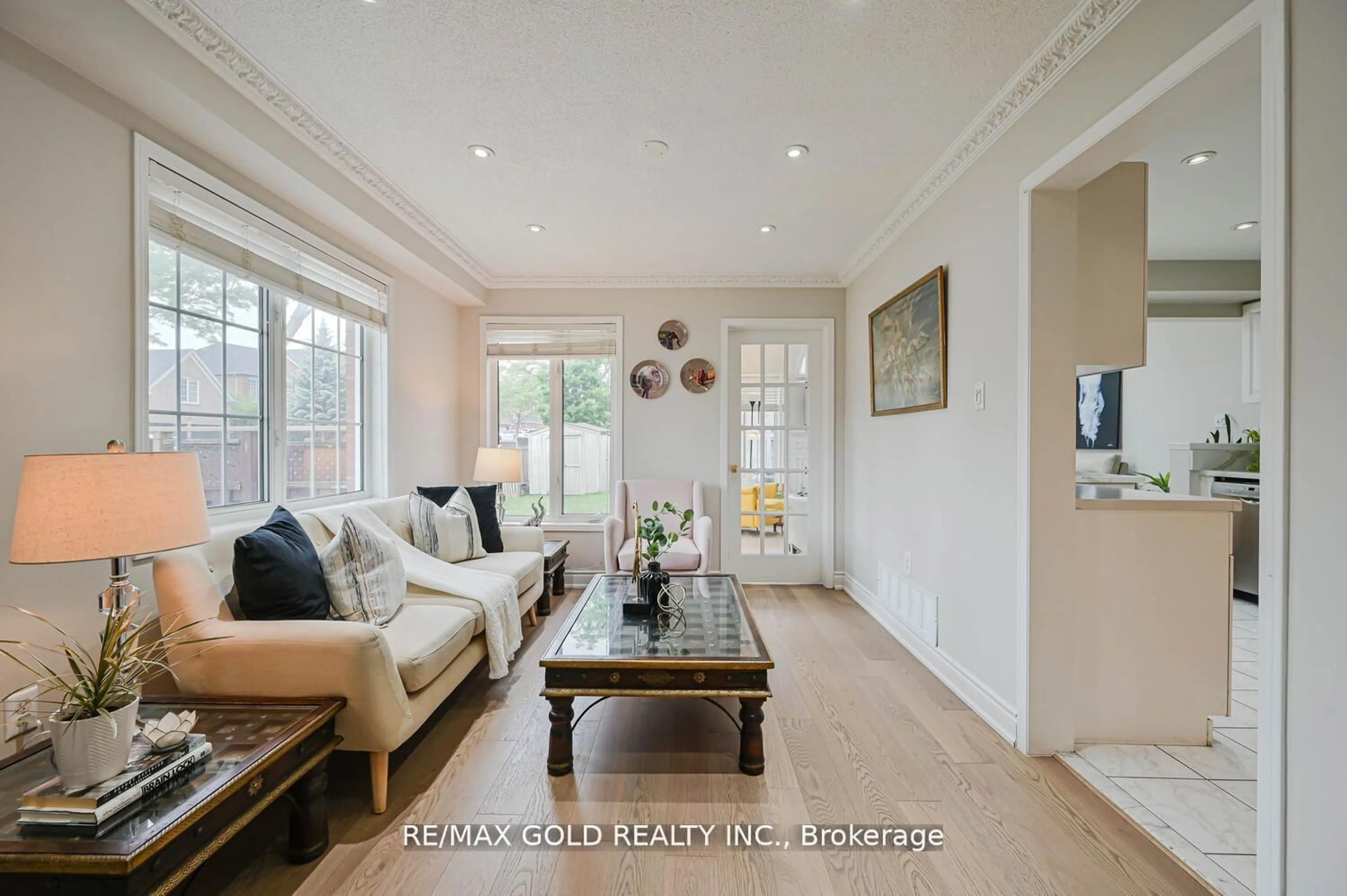Living room with furniture, wood/laminate floor for 44 Ribbon Dr, Brampton Ontario L6R 2C5