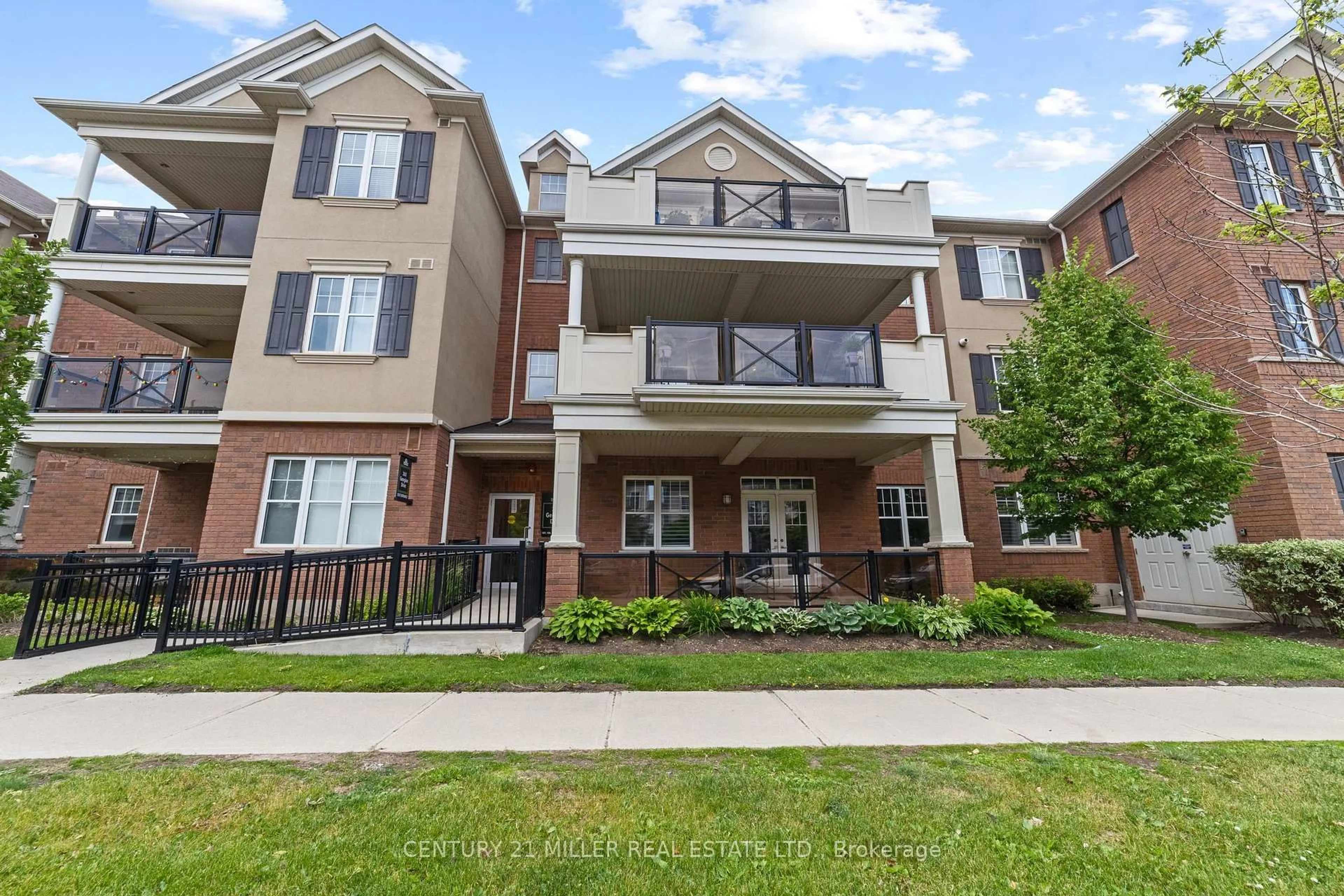 Home with brick exterior material, street for 263 Georgian Dr #207, Oakville Ontario L6H 0L2