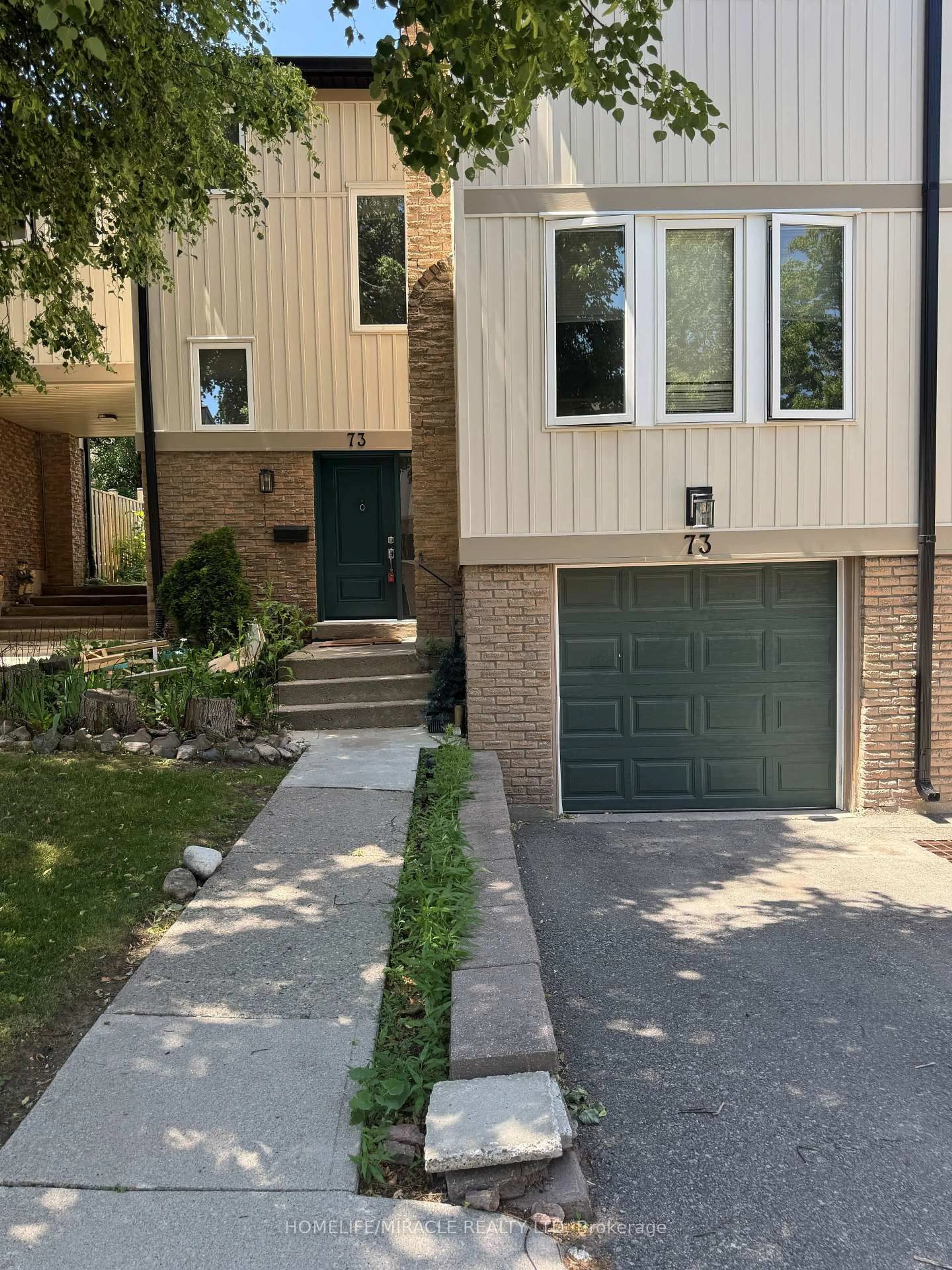 Home with brick exterior material, street for 7080 Copenhagen Rd #73, Mississauga Ontario L5N 2C9