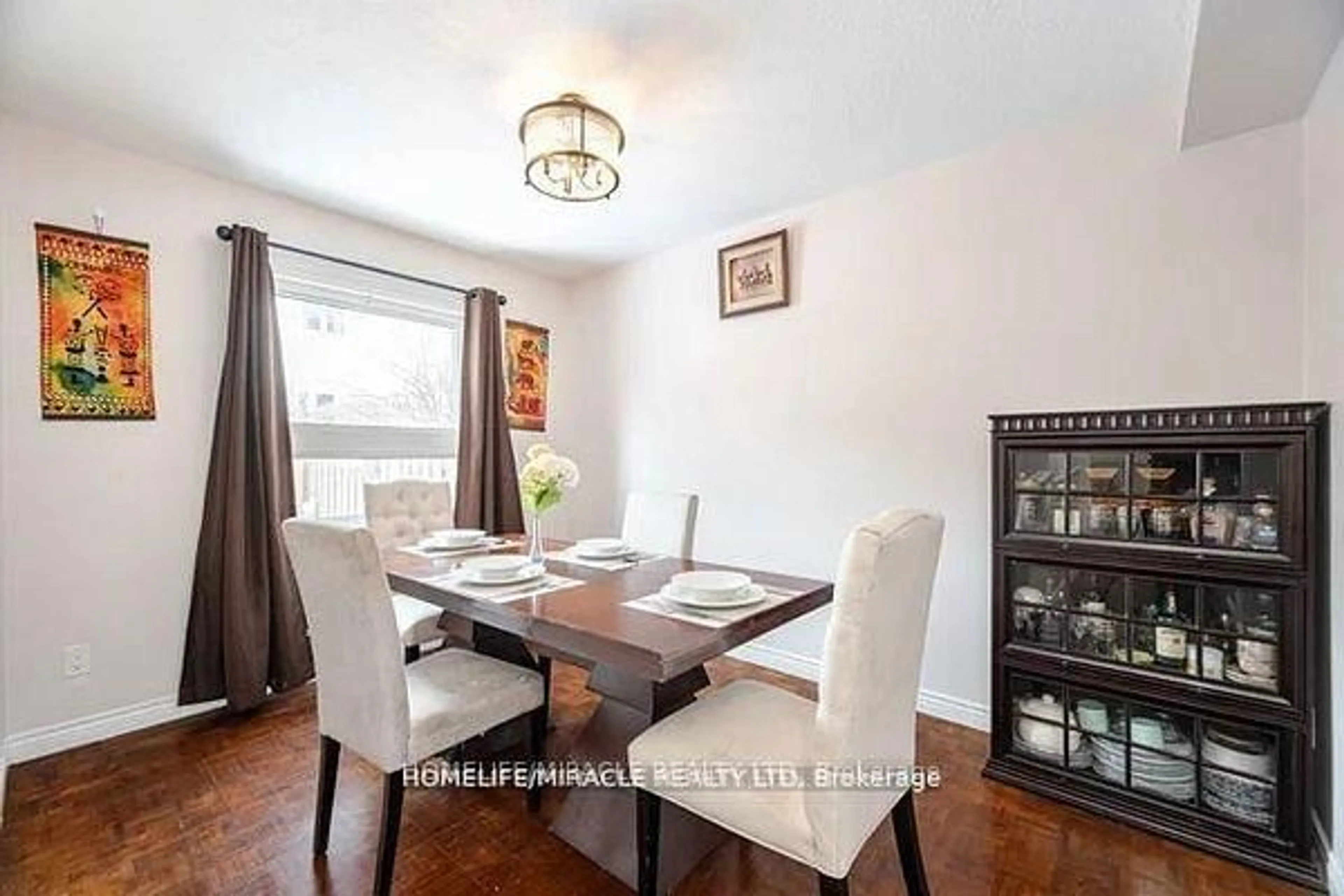 Dining room, wood/laminate floor for 7080 Copenhagen Rd #73, Mississauga Ontario L5N 2C9