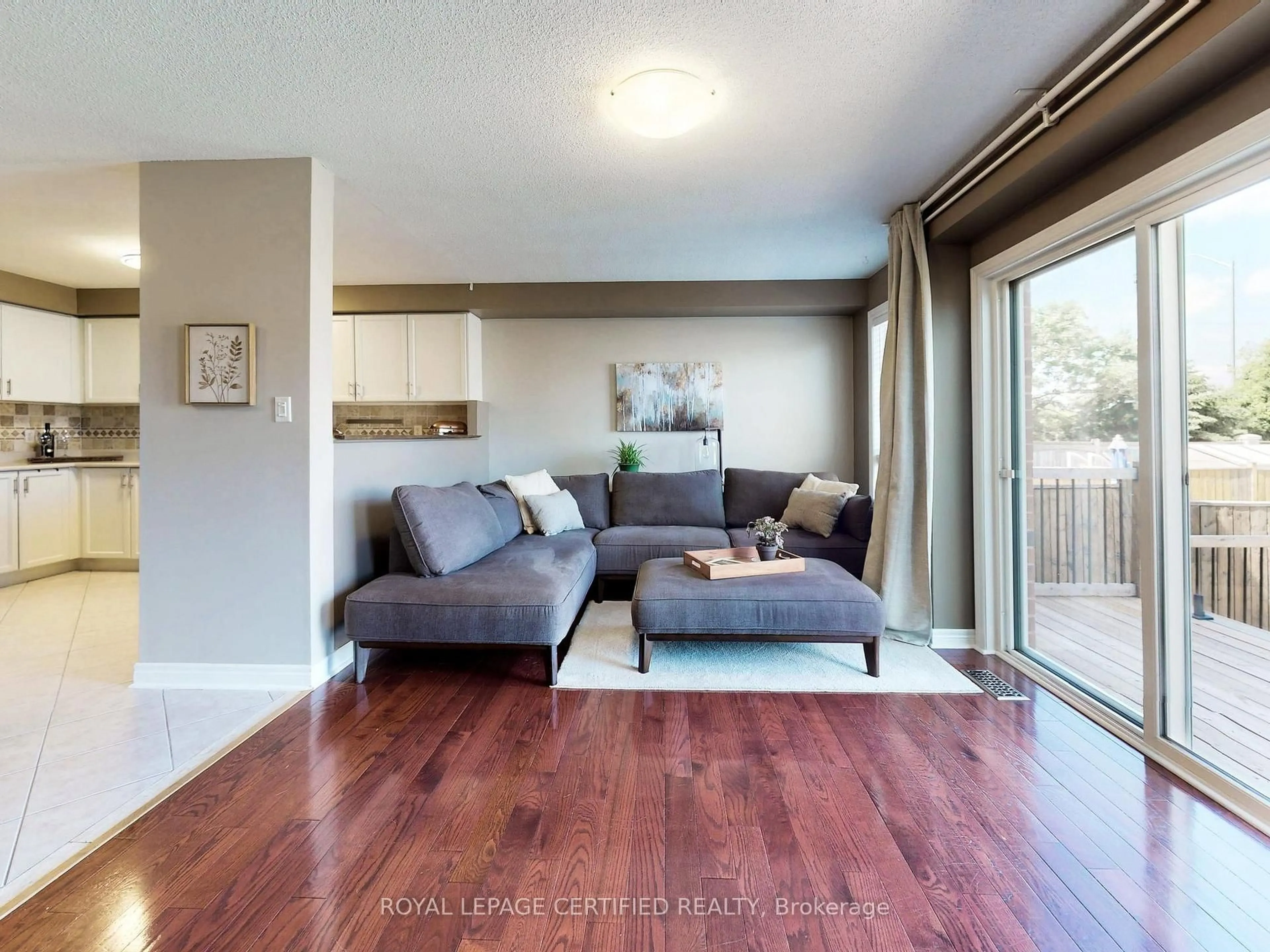 Living room with furniture, wood/laminate floor for 36 Aida Crt, Caledon Ontario L7E 2G8