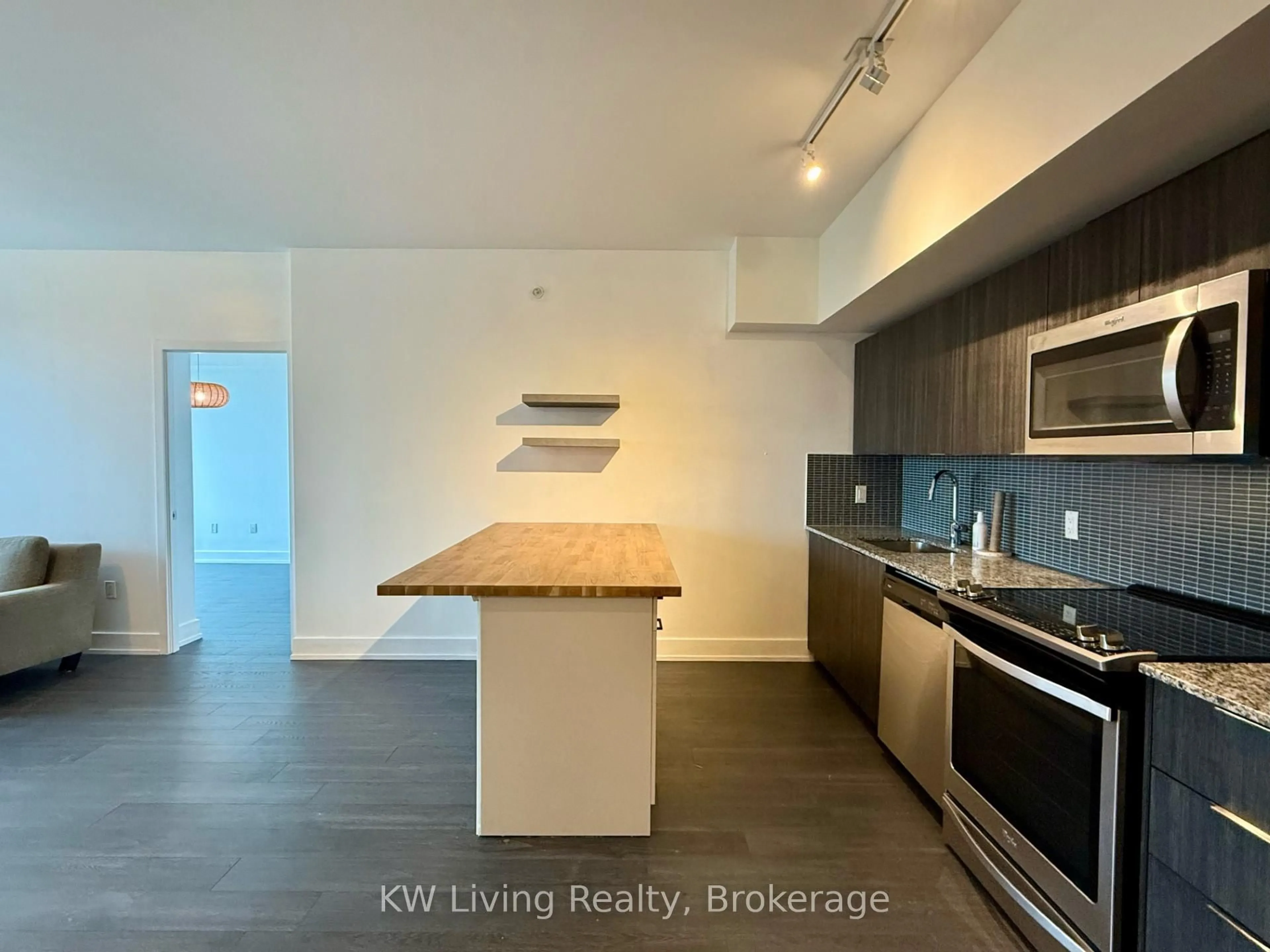 Open concept kitchen, wood/laminate floor for 30 Shore Breeze Dr #428, Toronto Ontario M8V 0J1