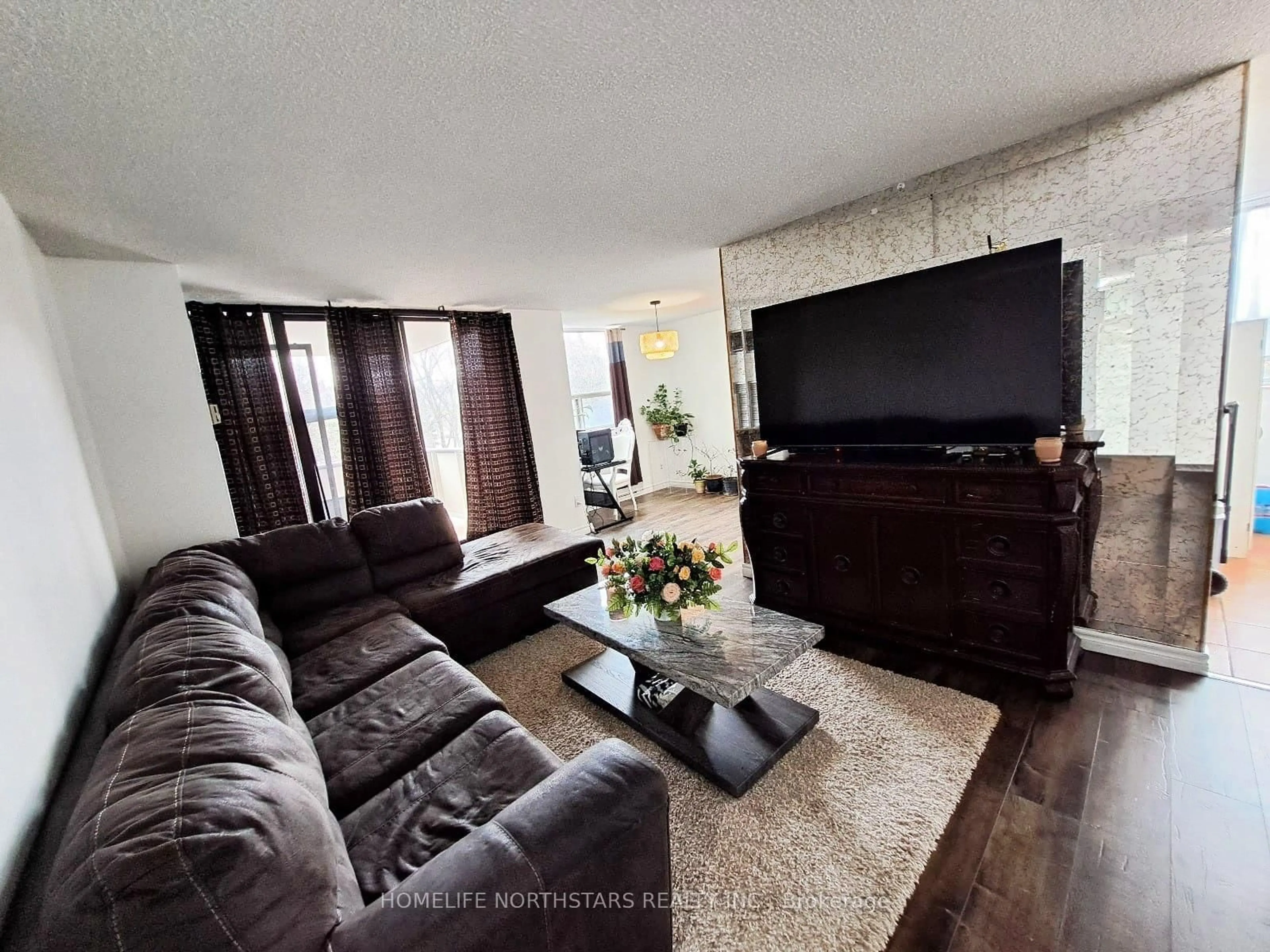 Living room with furniture, unknown for 3 Lisa St #309, Brampton Ontario L6T 4A2