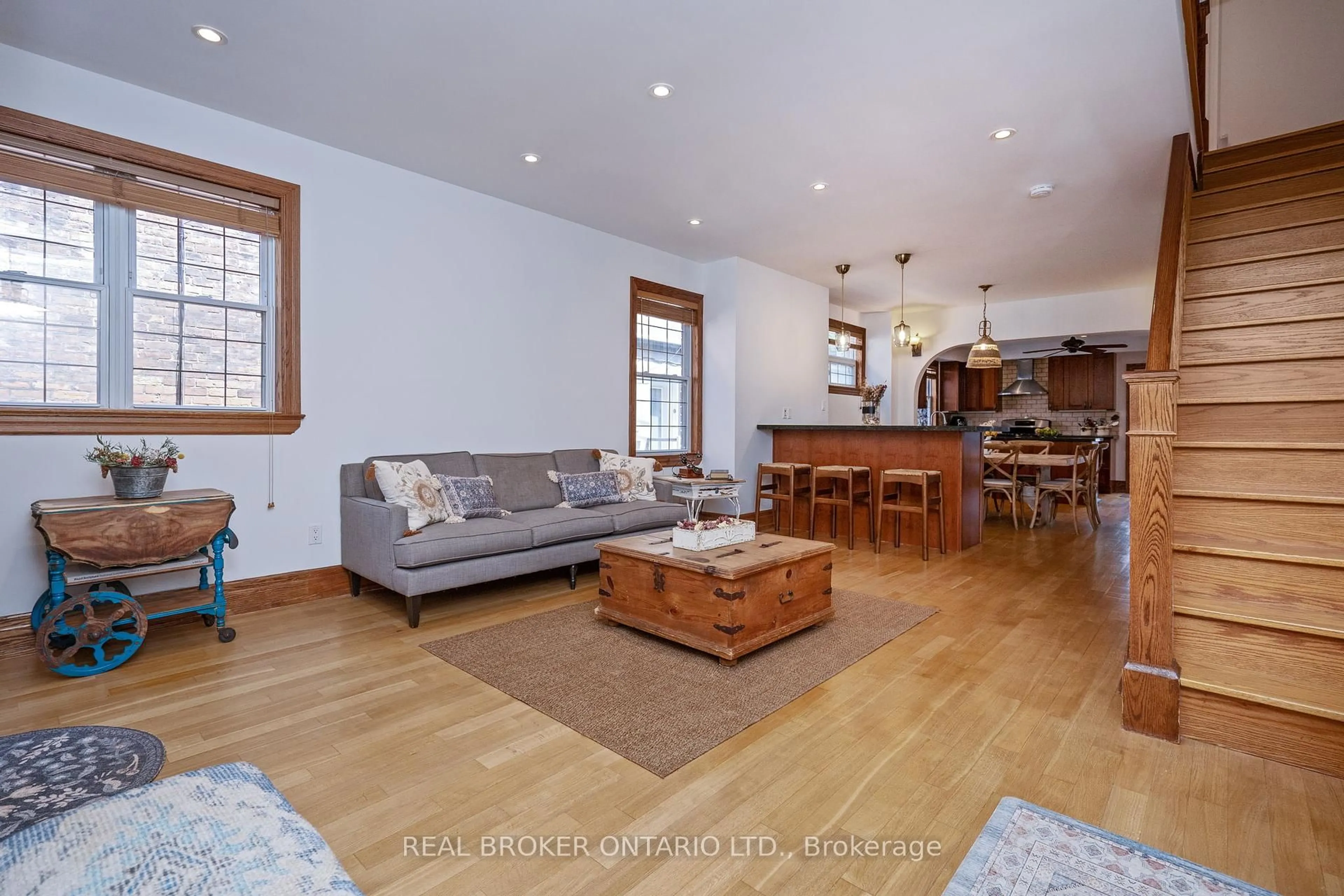 Living room with furniture, wood/laminate floor for 241 Bartlett Ave, Toronto Ontario M6H 3G3