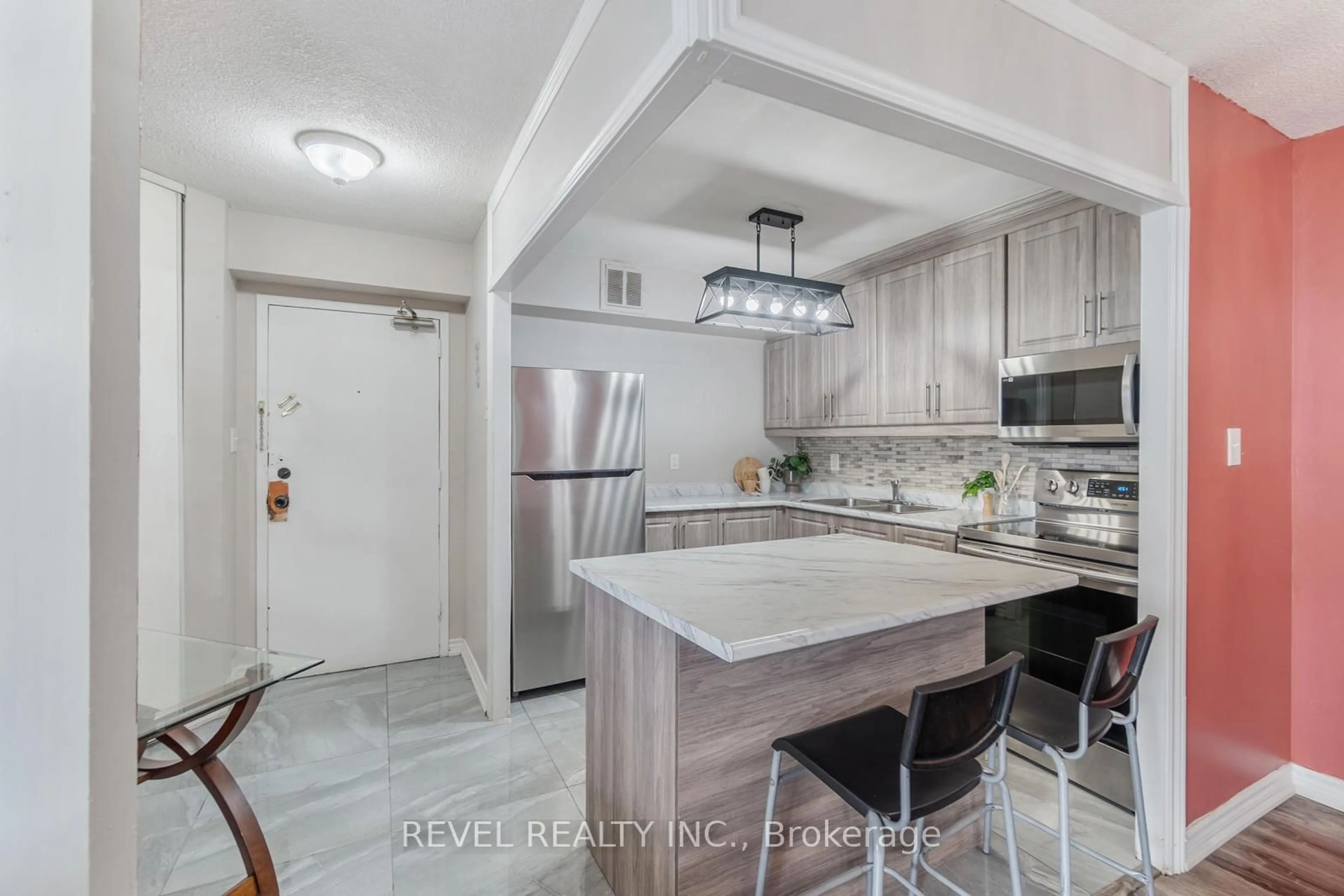 Open concept kitchen, ceramic/tile floor for 330 Dixon Rd #706, Toronto Ontario M9R 1S9