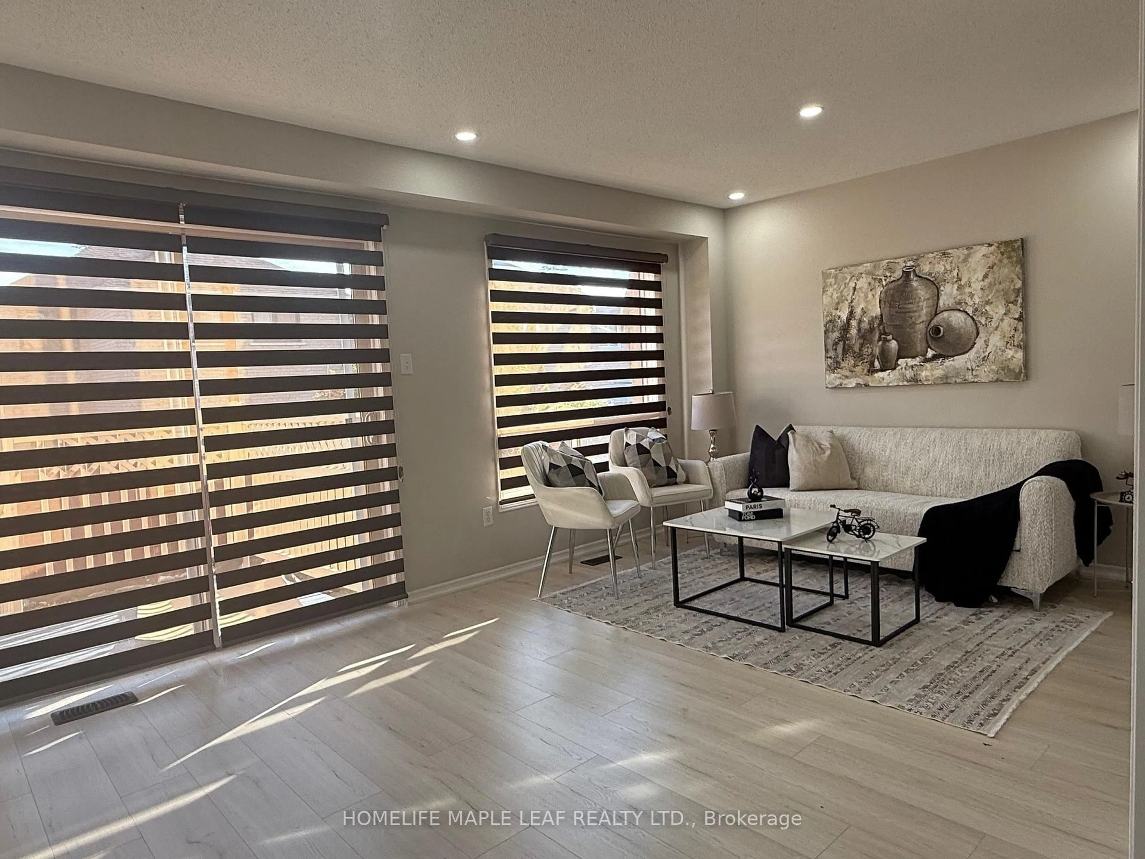 Living room with furniture, wood/laminate floor for 33 Kitto Crt, Brampton Ontario L6Y 5B1