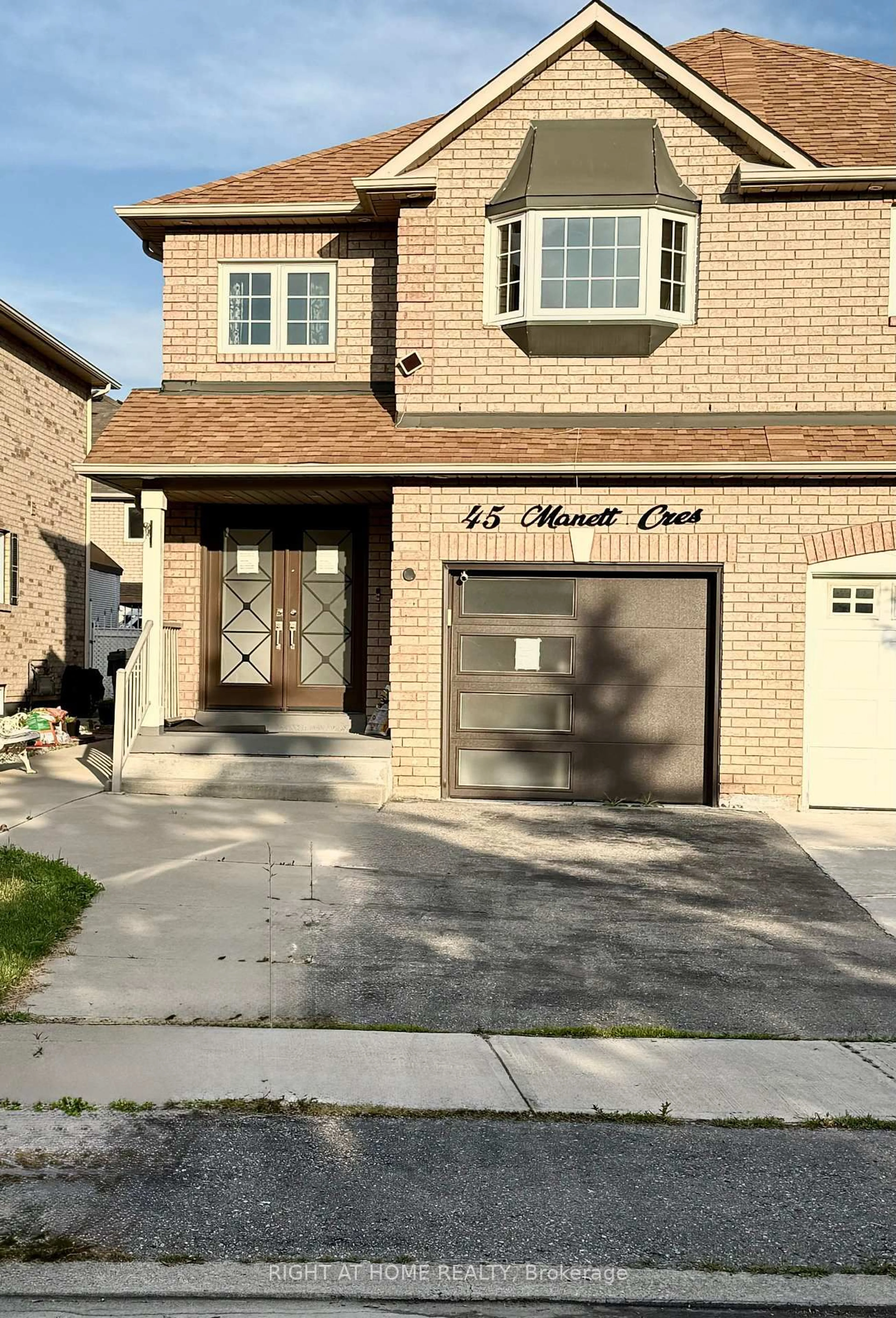 Home with brick exterior material, street for 45 Manett Cres, Brampton Ontario L6X 4X4