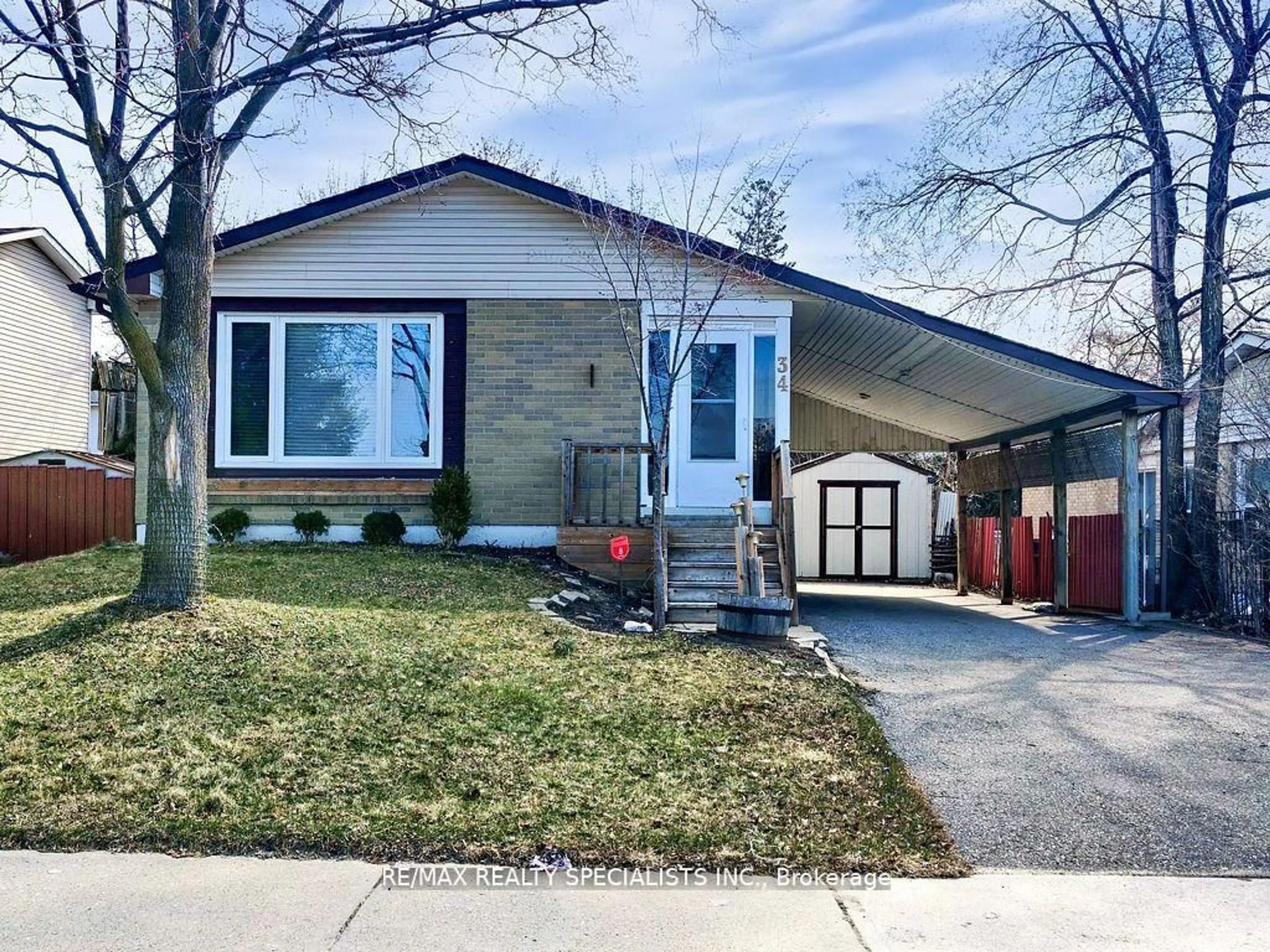 Home with vinyl exterior material, street for 34 Madoc Dr, Brampton Ontario L6V 1Z9