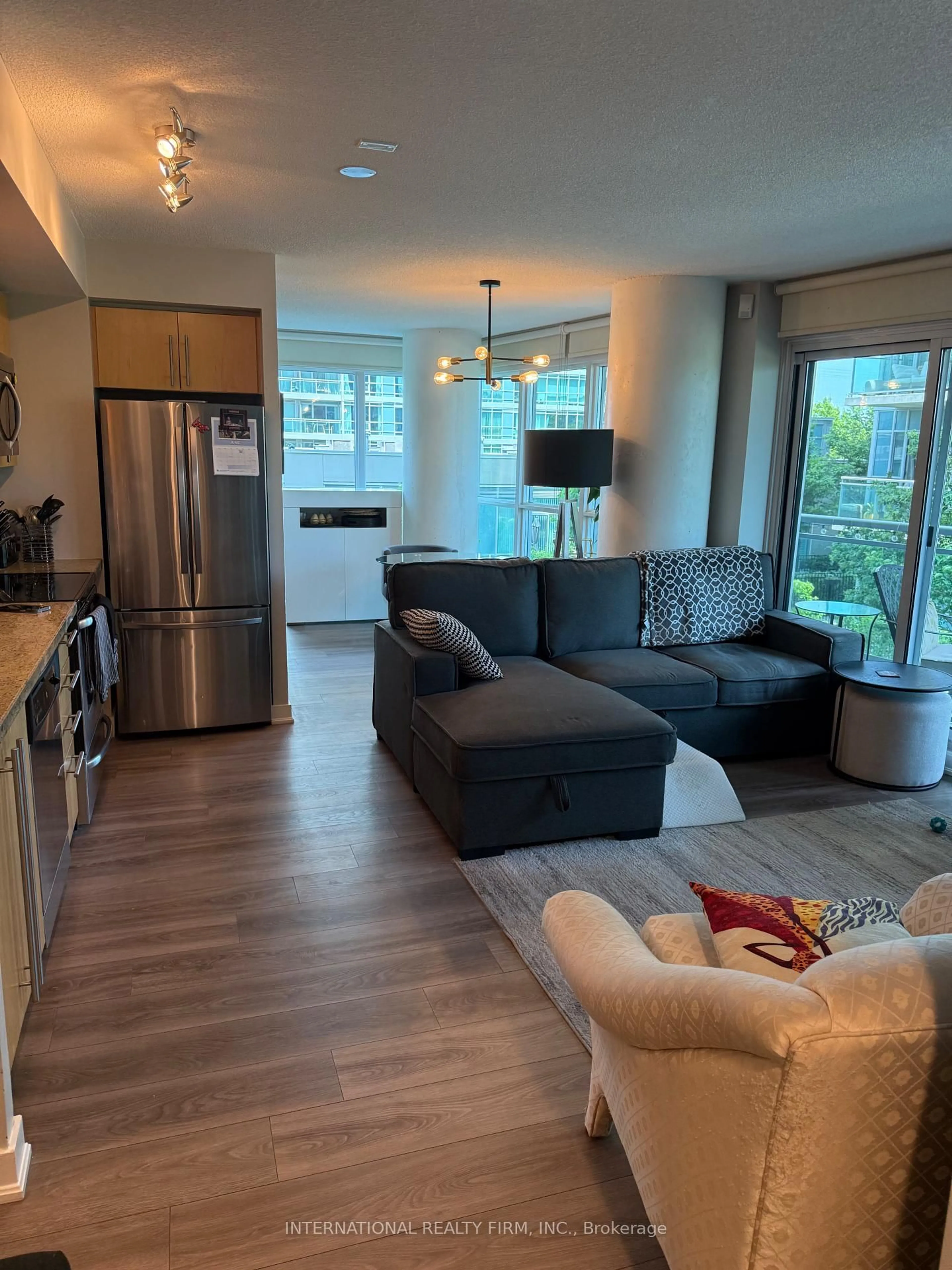 Living room with furniture, wood/laminate floor for 155 Legion Rd #513, Toronto Ontario M8Y 0A7