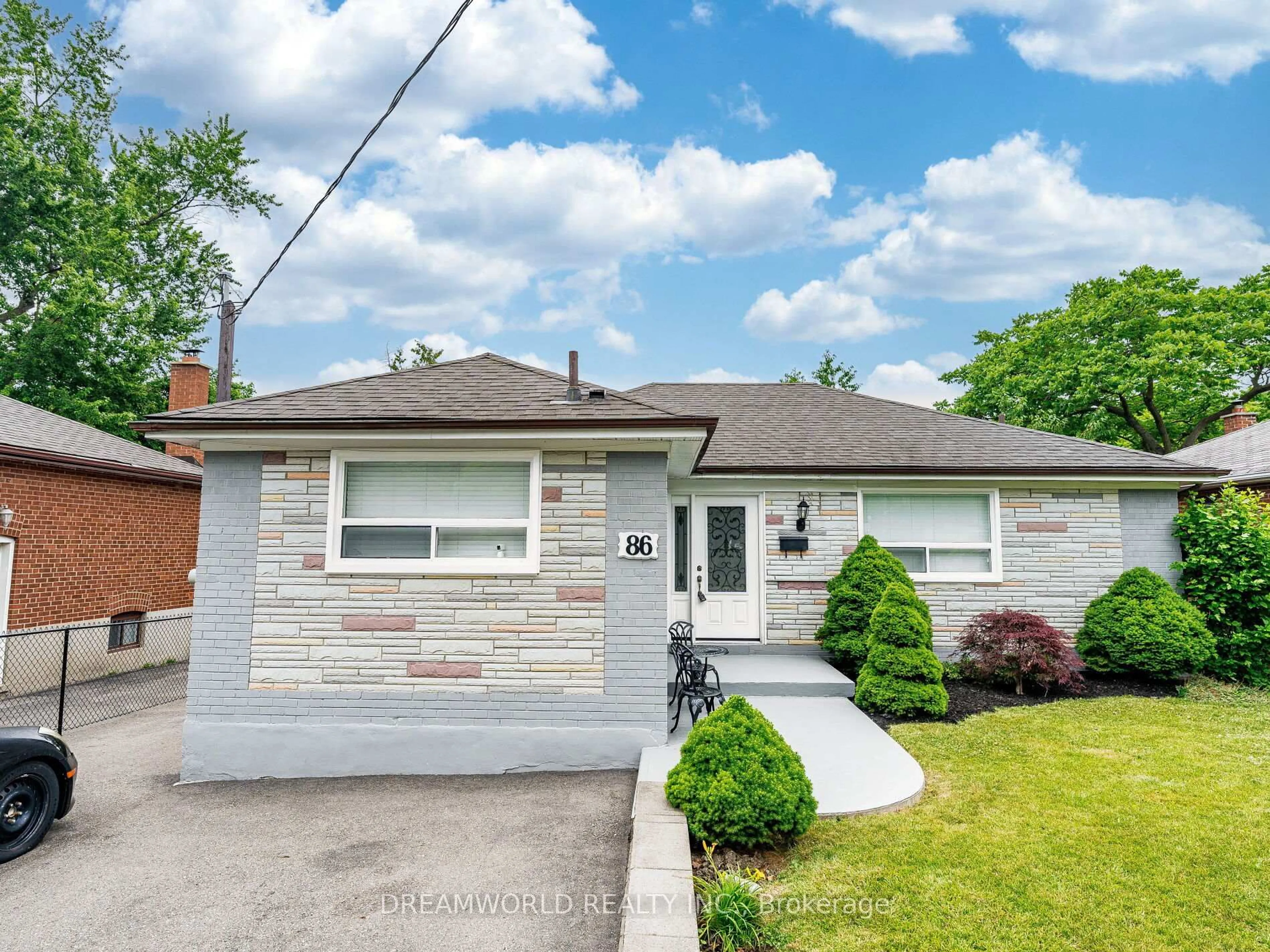 Home with brick exterior material, street for 86 Exbury Rd, Toronto Ontario M3M 1R1