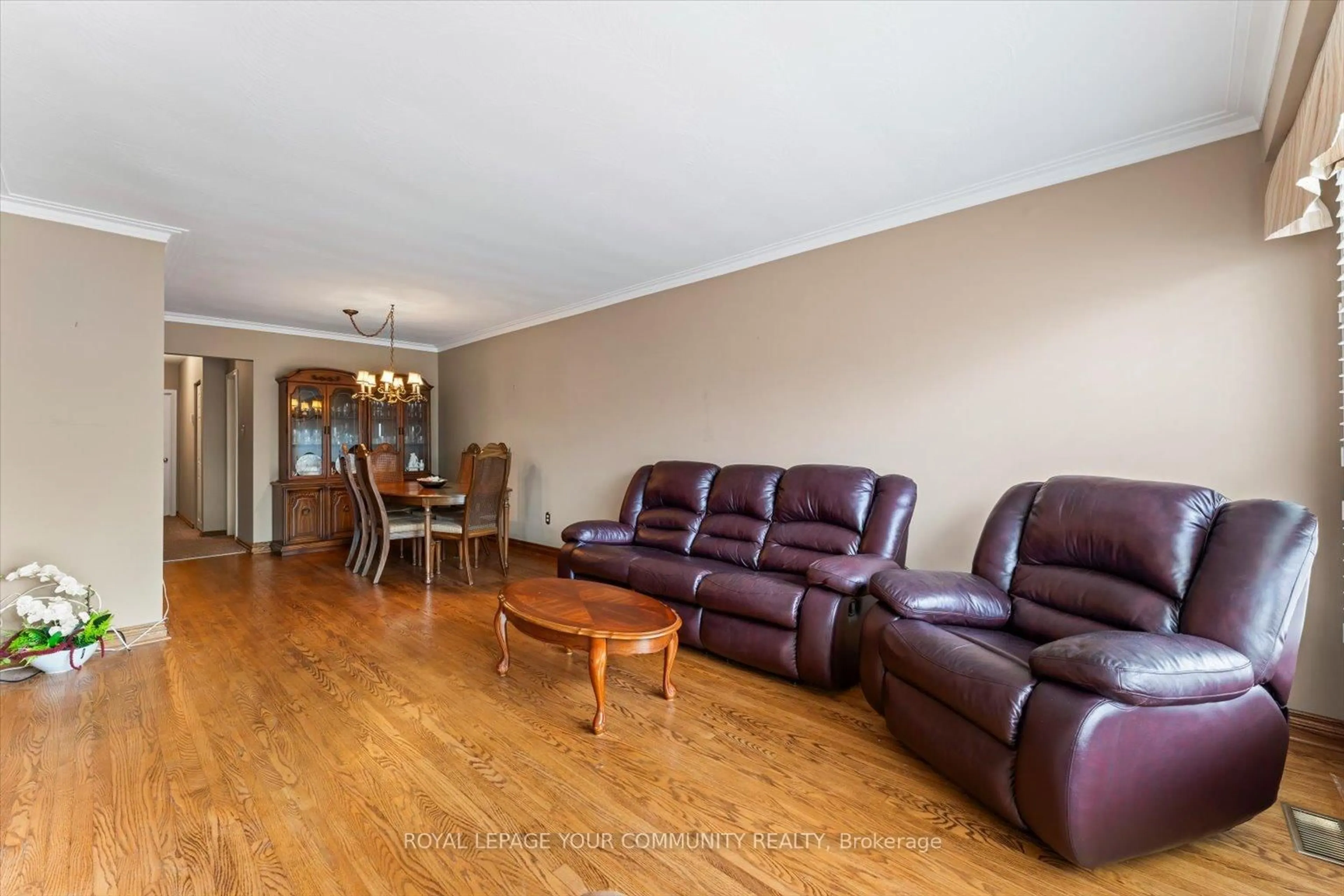 Living room with furniture, wood/laminate floor for 175 Lindylou Rd, Toronto Ontario M9M 2B8