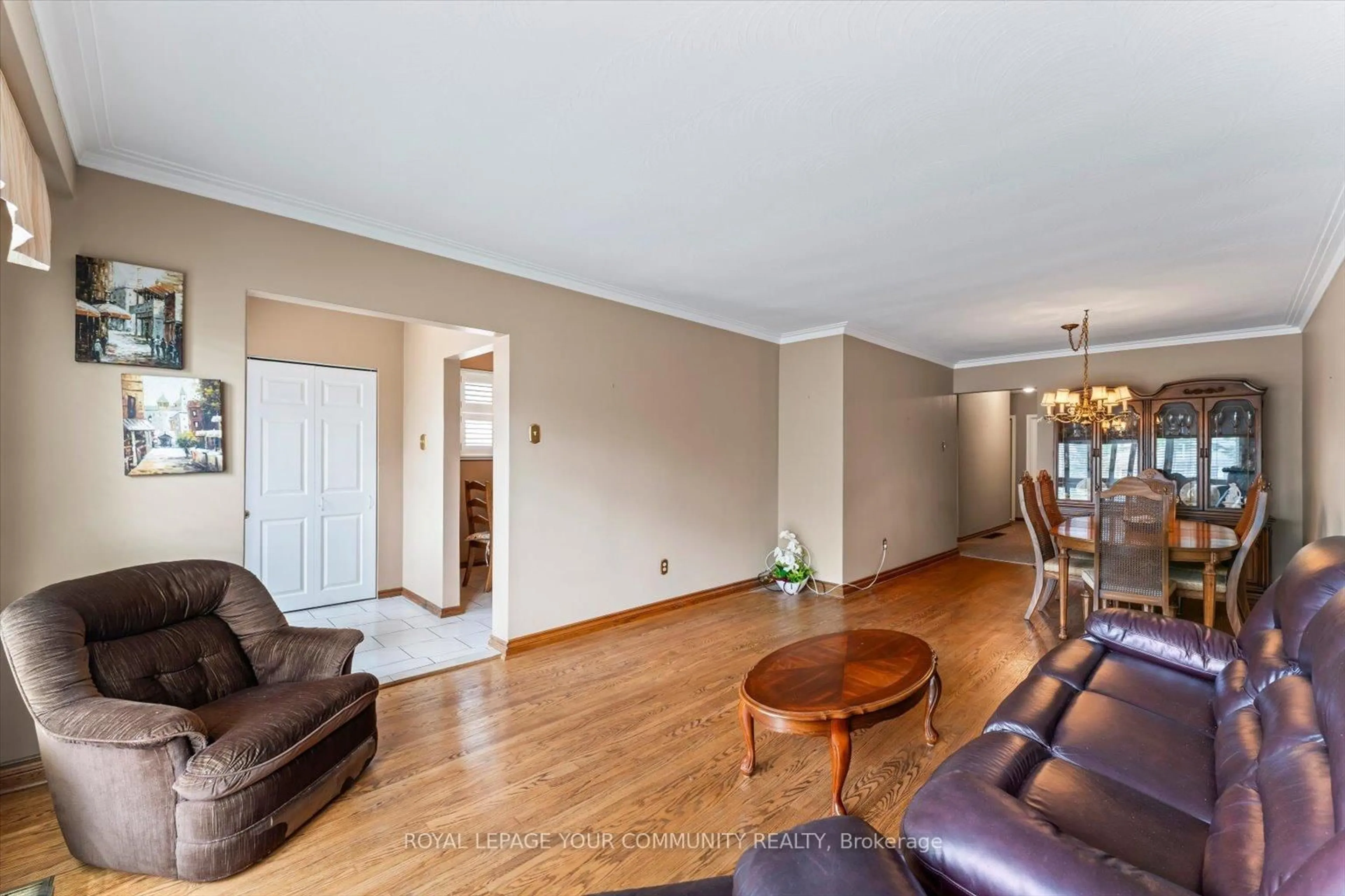 Living room with furniture, wood/laminate floor for 175 Lindylou Rd, Toronto Ontario M9M 2B8