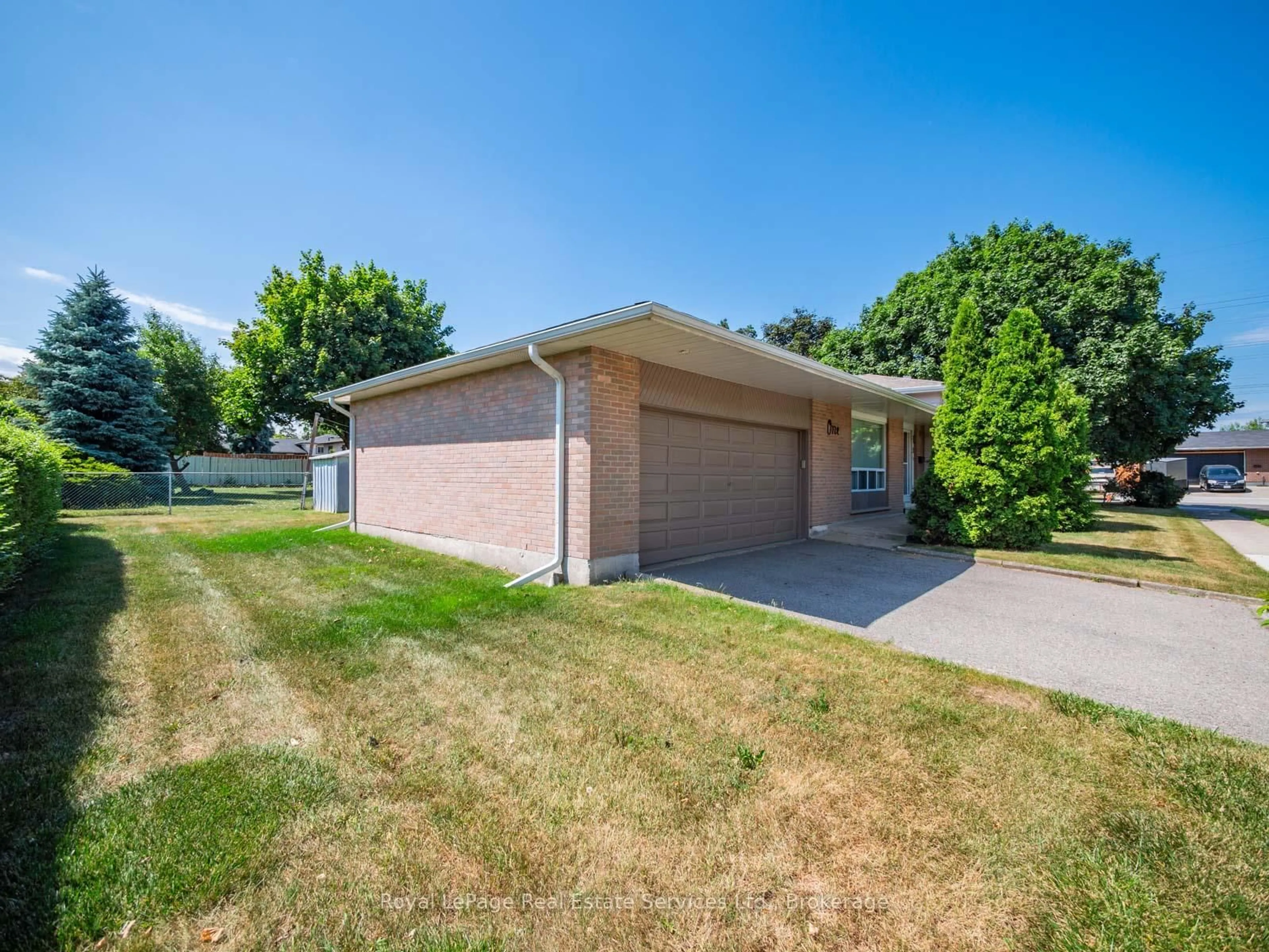 Home with brick exterior material, street for 1 Mosswood Lane, Toronto Ontario M9V 1M3