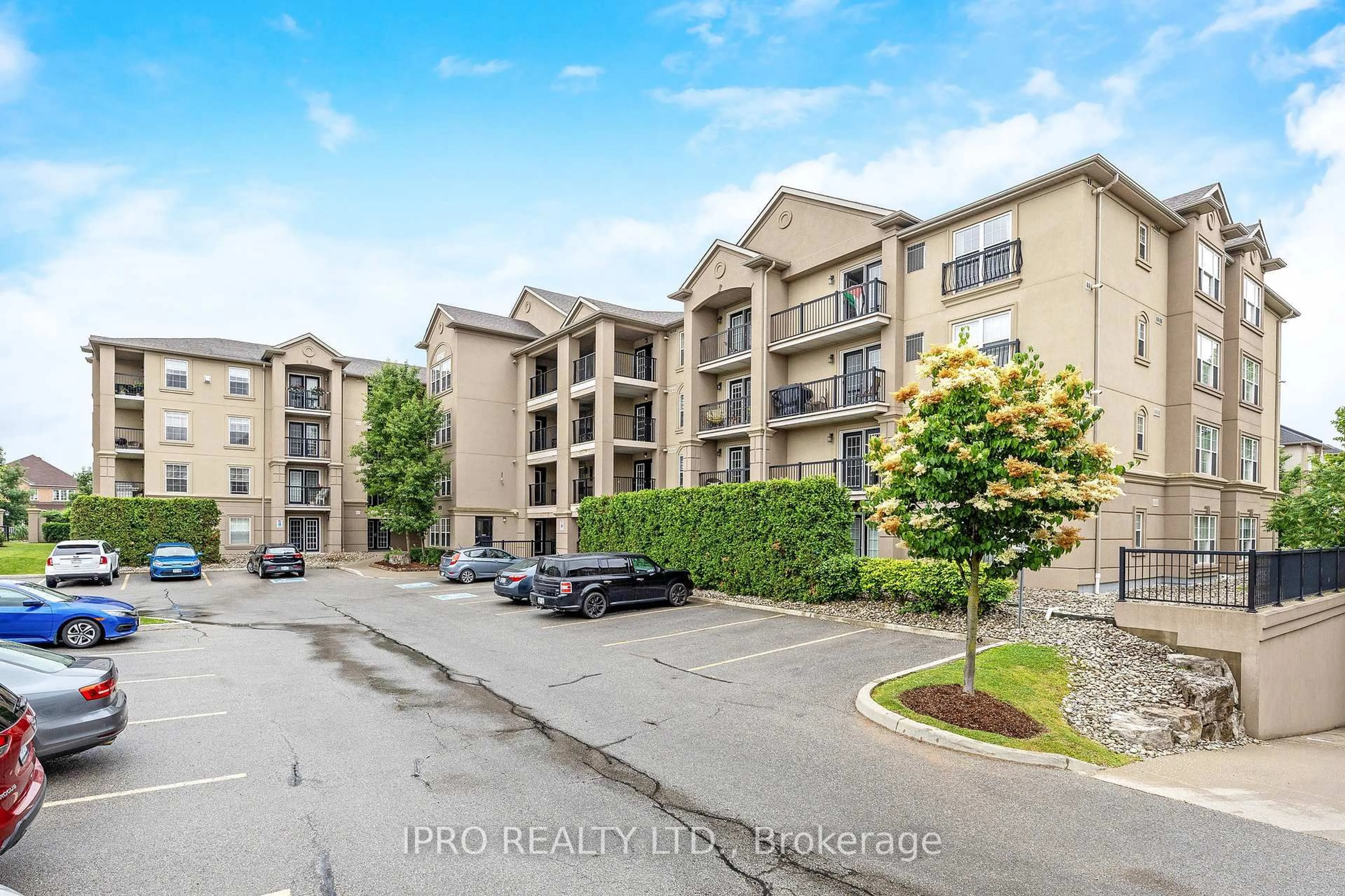 A pic from outside/outdoor area/front of a property/back of a property/a pic from drone, water/lake/river/ocean view for 1350 Main St #110, Milton Ontario L9T 7S6