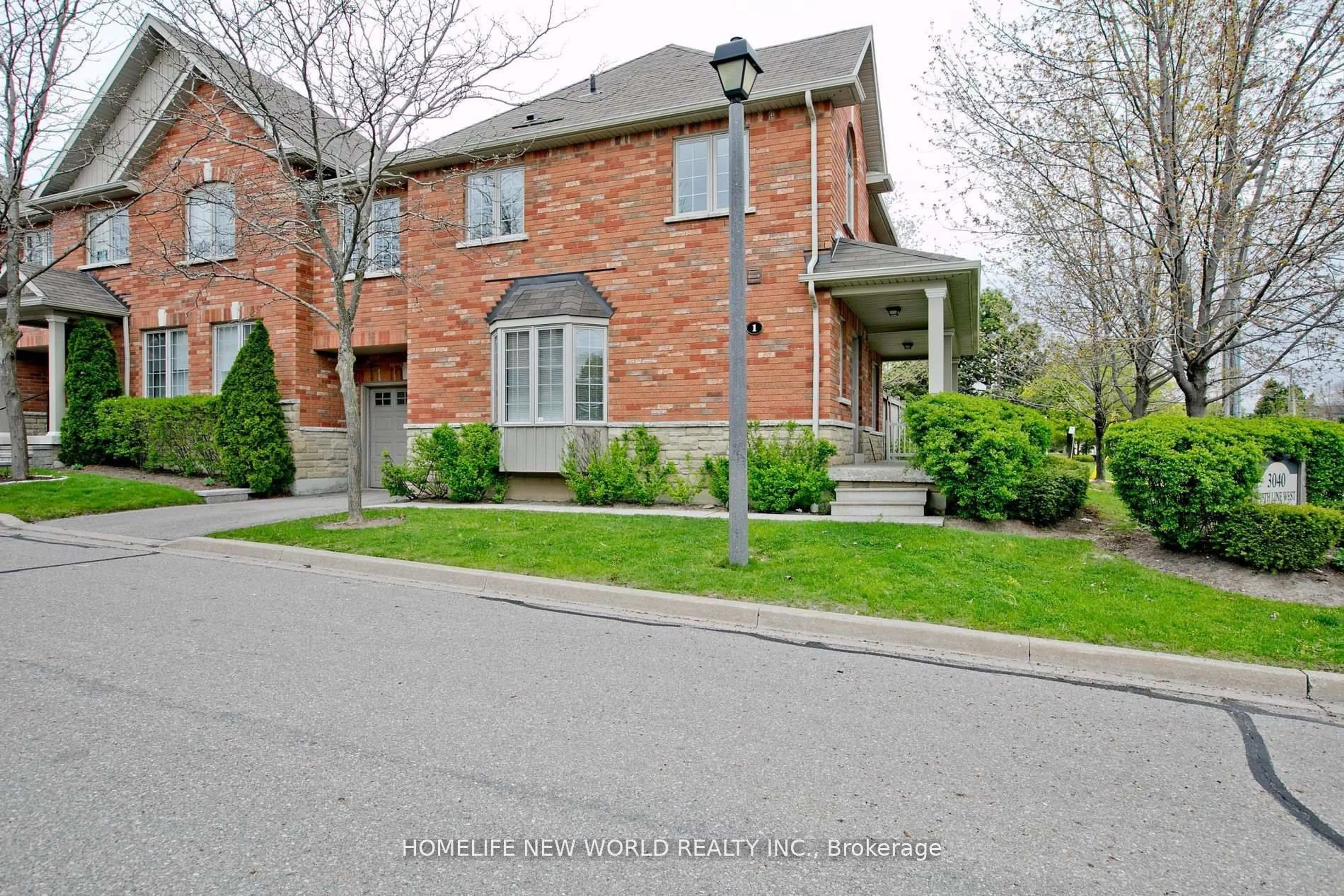 Home with brick exterior material, street for 3040 Fifth Line #1, Mississauga Ontario L5L 0A4
