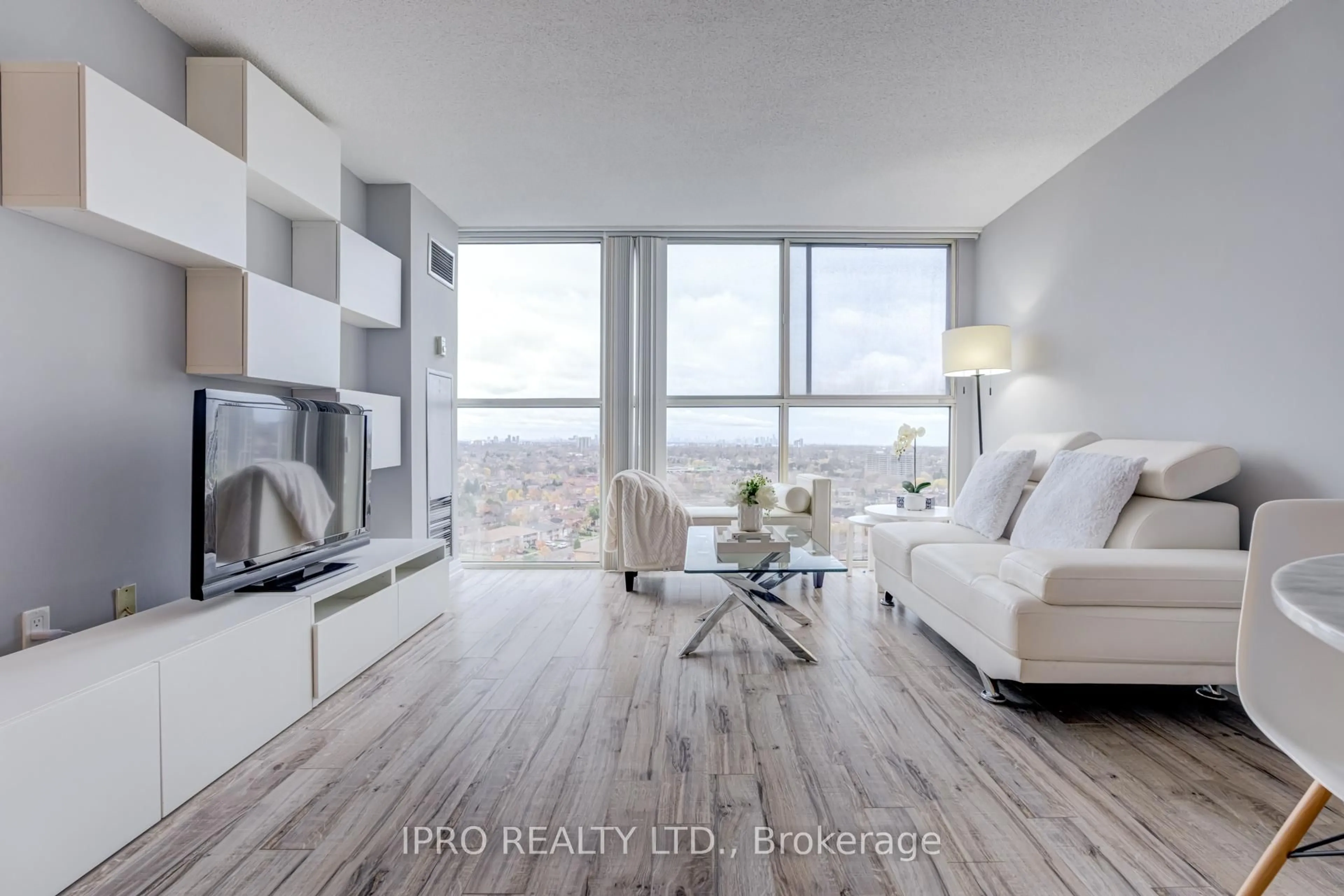 Living room with furniture, wood/laminate floor for 4185 Shipp Dr #1616, Mississauga Ontario L4Z 2Y9