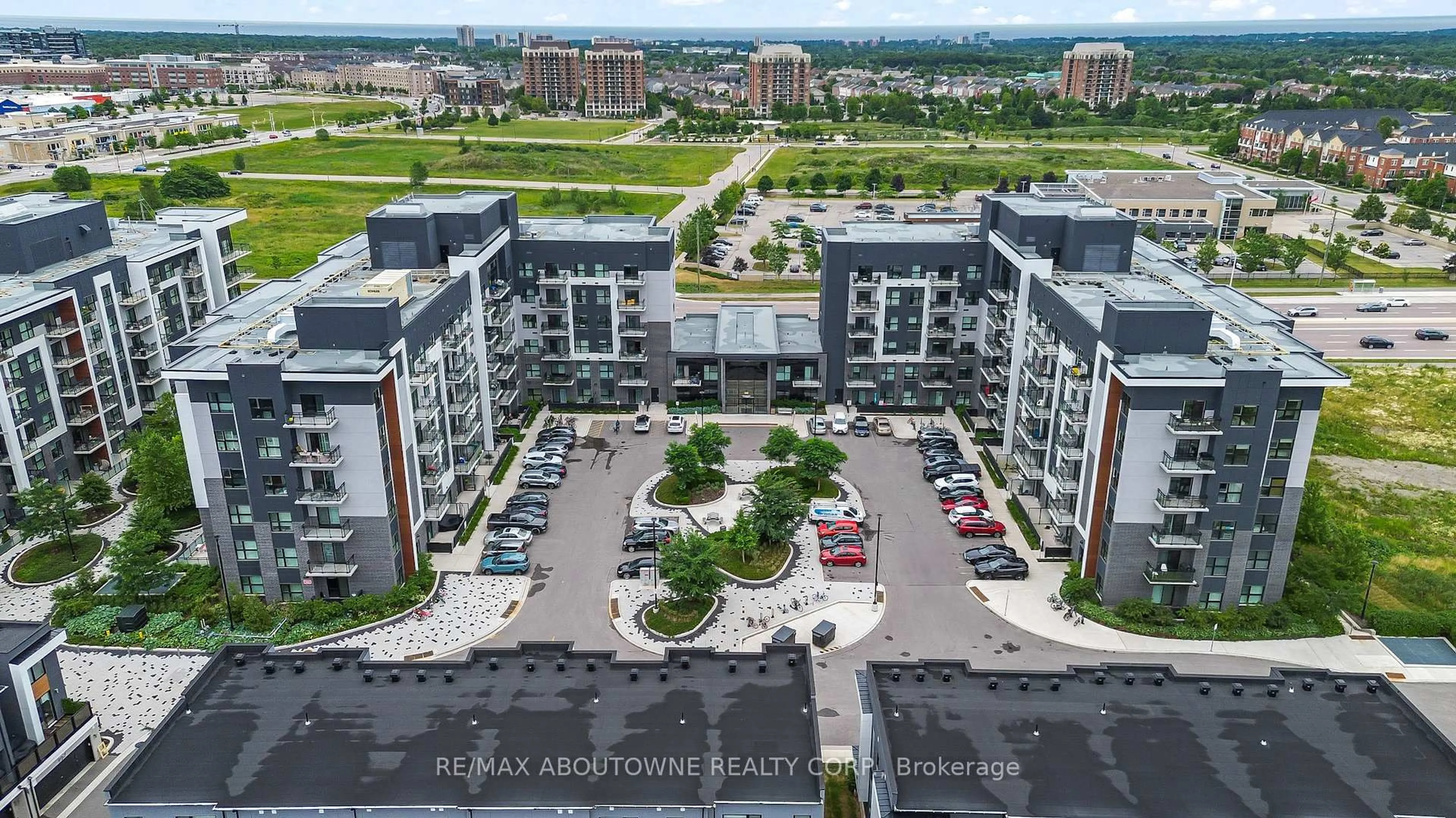 A pic from outside/outdoor area/front of a property/back of a property/a pic from drone, city buildings view from balcony for 102 Grovewood Common #121, Oakville Ontario L6H 0X2