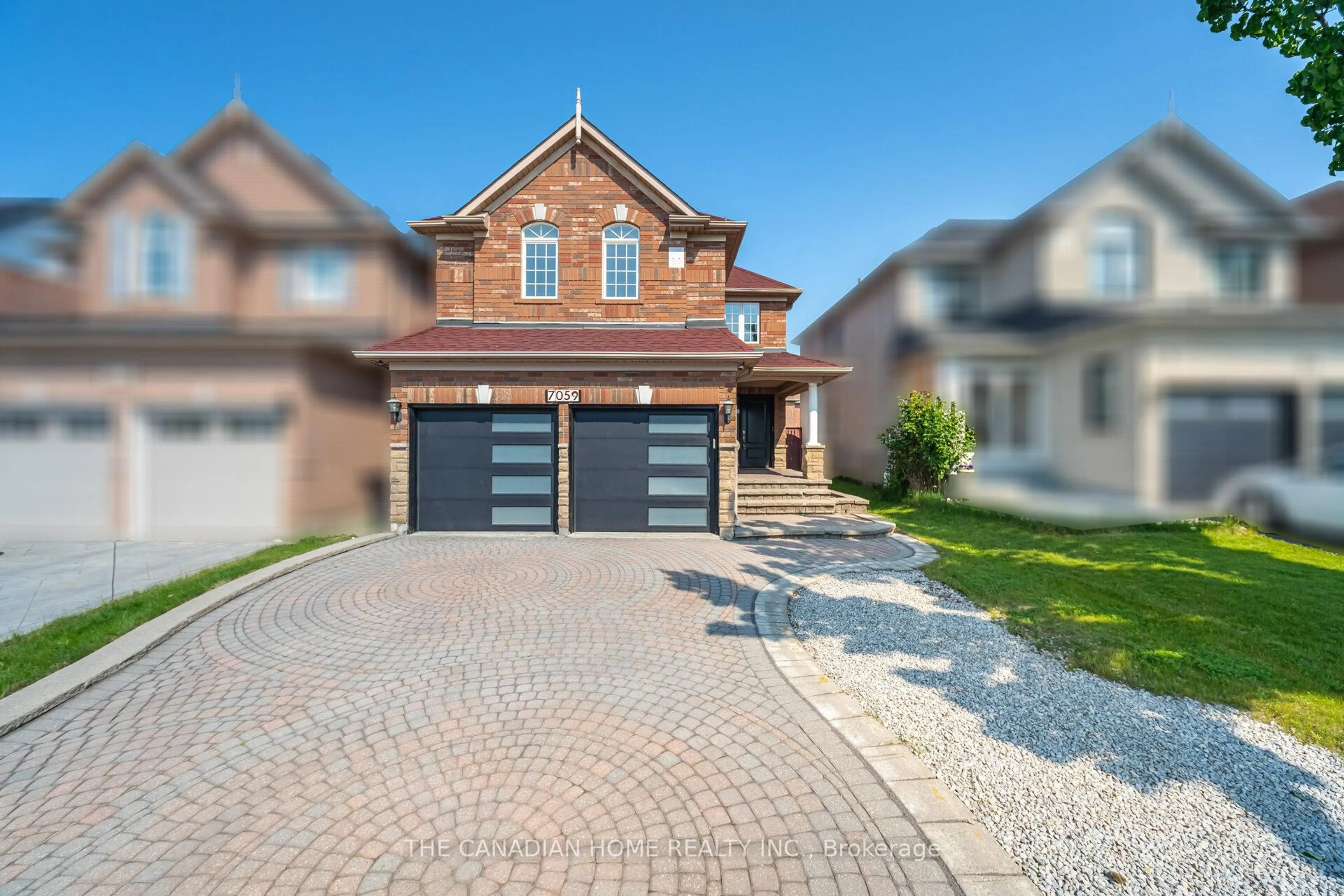Home with brick exterior material, street for 7059 Magistrate Terr, Mississauga Ontario L5W 1E5