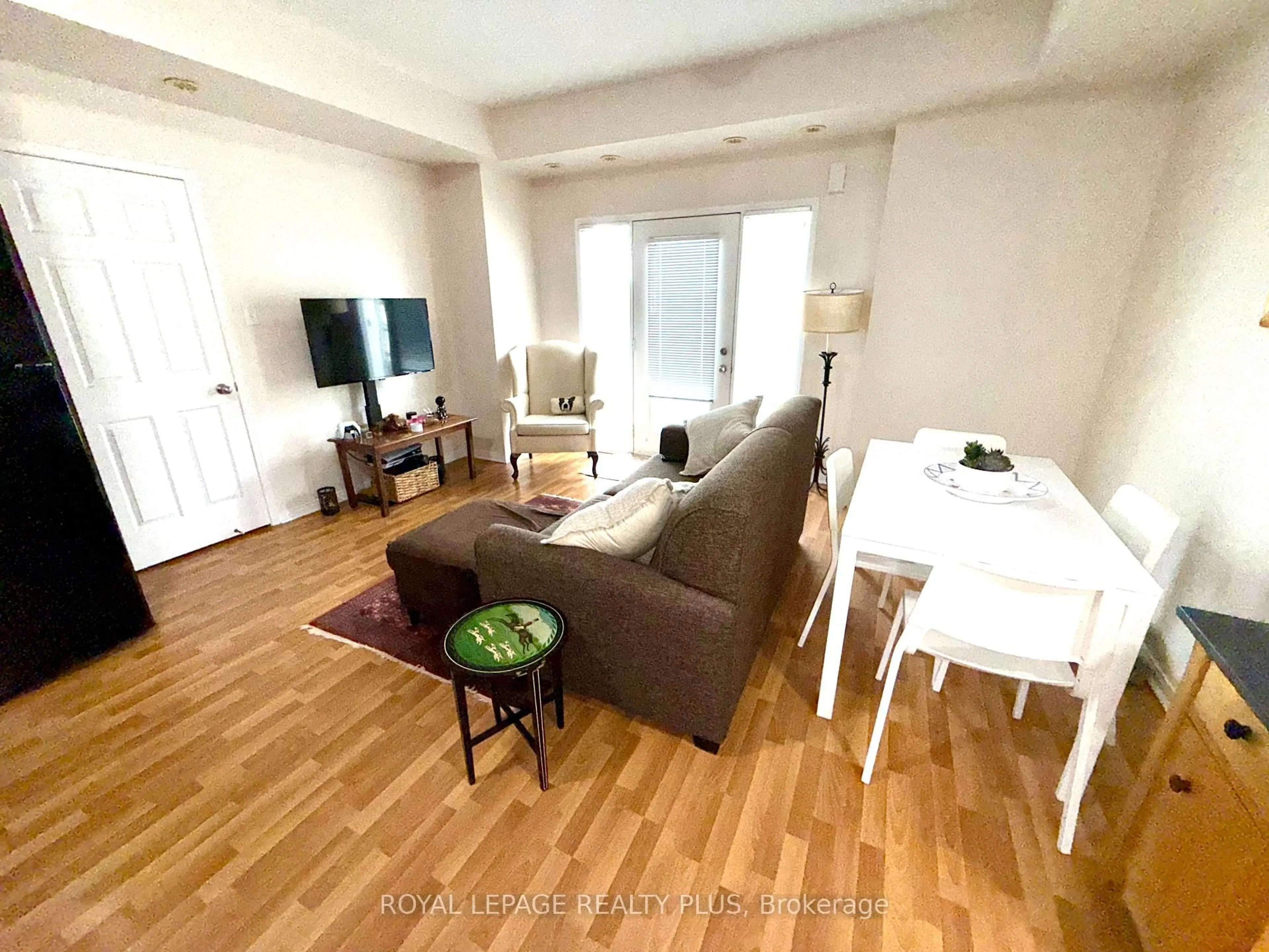 Living room with furniture, wood/laminate floor for 3015 Destination Dr #5, Mississauga Ontario L5M 0P3