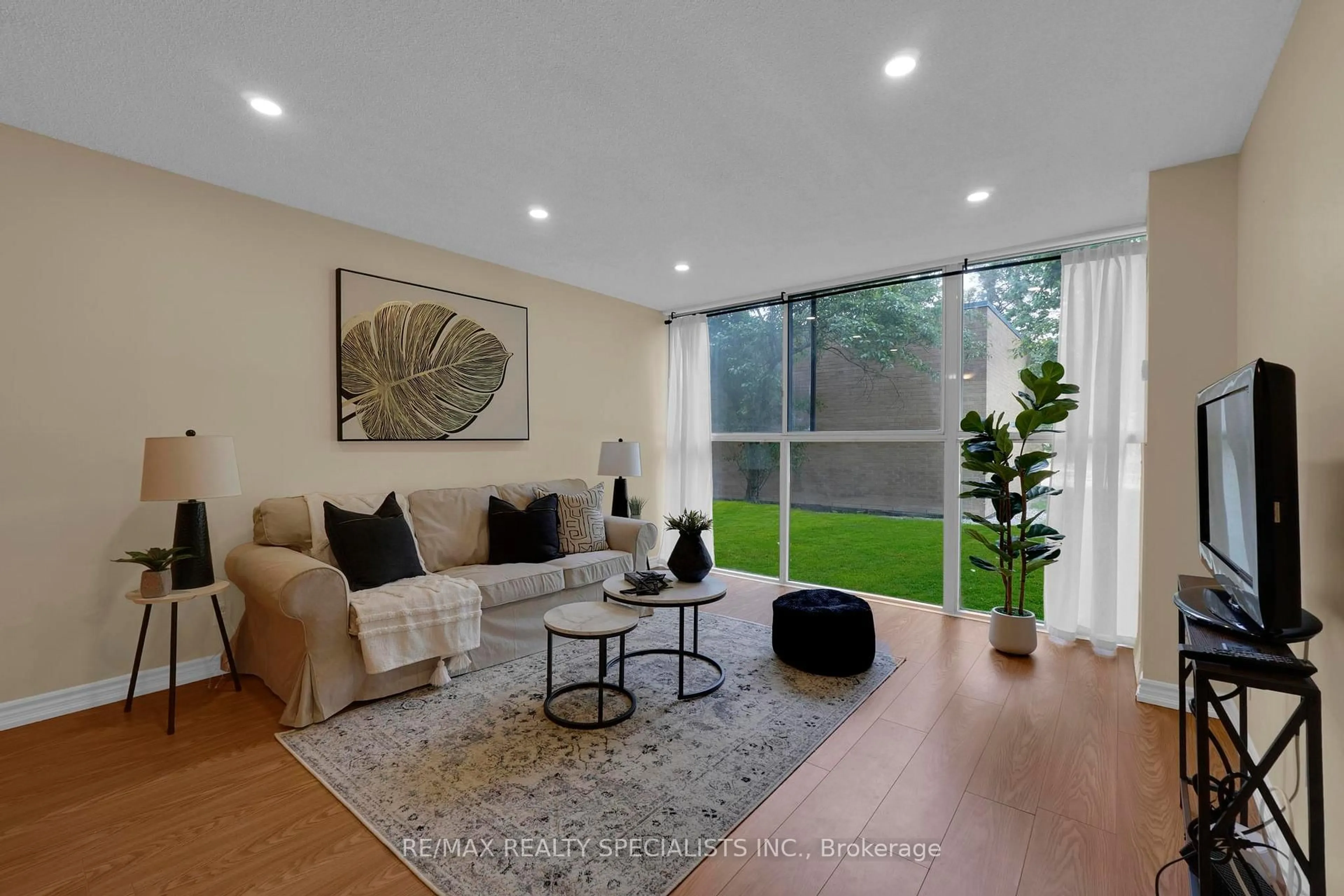 Living room with furniture, unknown for 35 Trailwood Dr #113, Mississauga Ontario L4Z 3L6