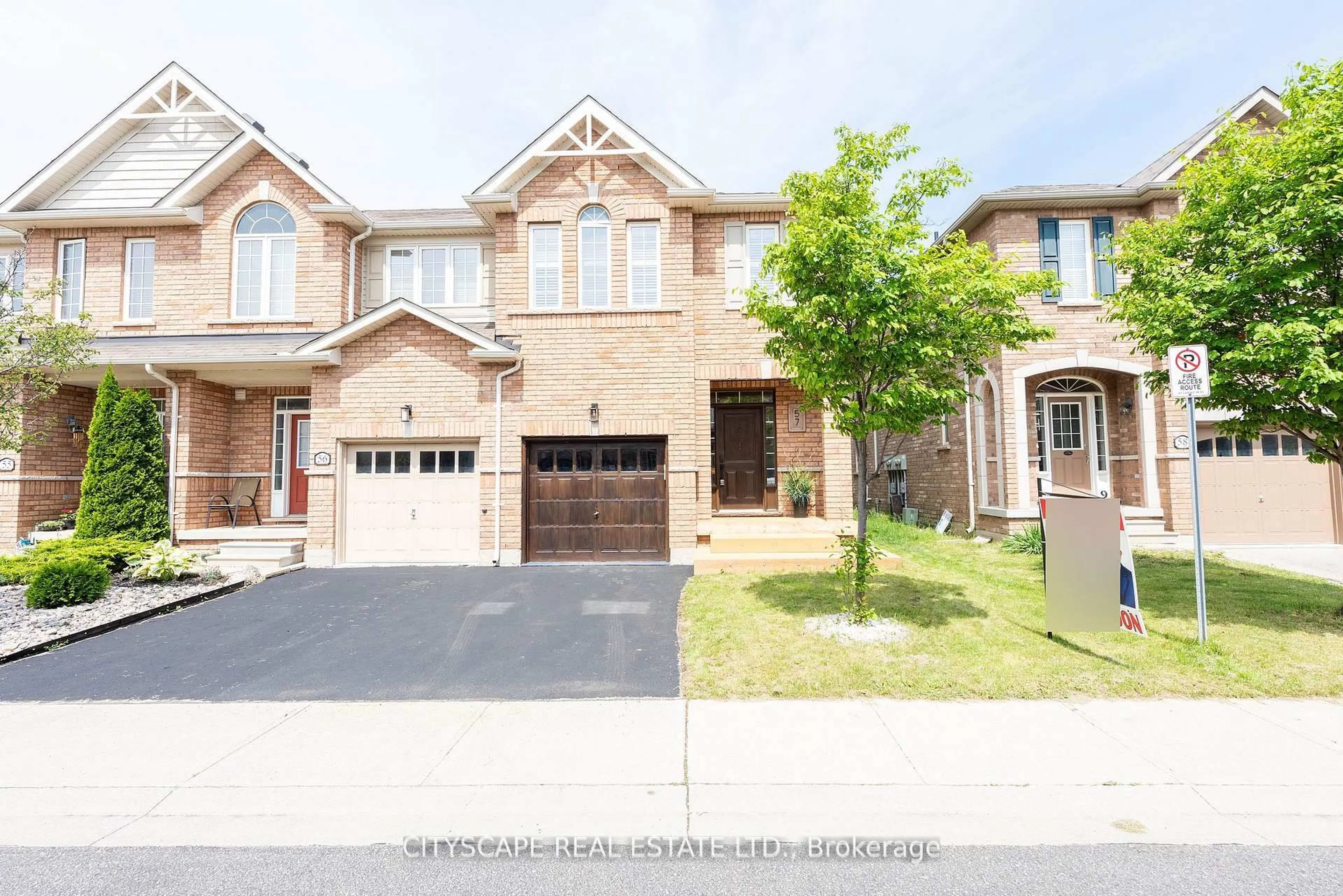 Home with brick exterior material, street for 651 Farmstead Dr #57, Milton Ontario L9T 7W2