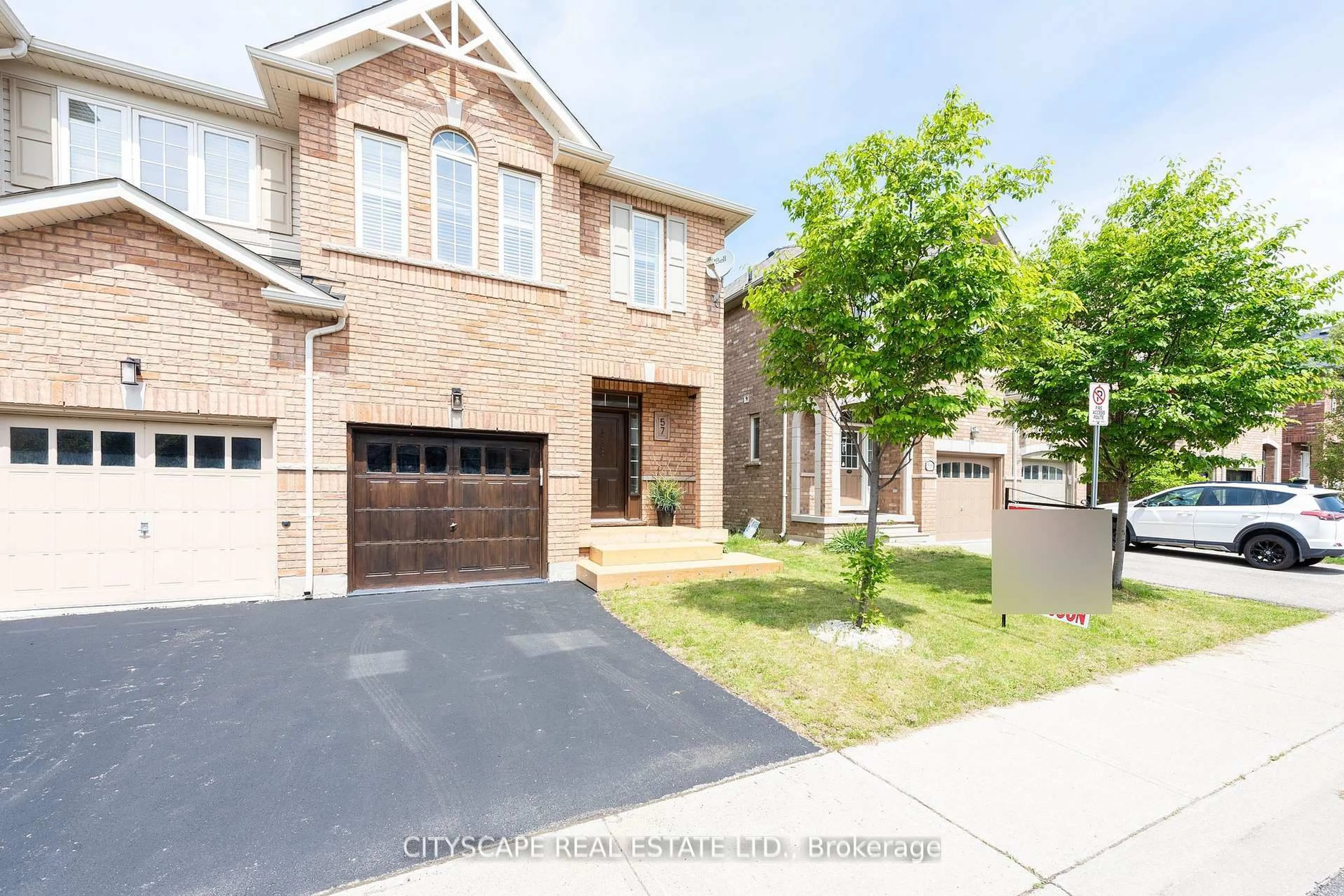 Home with brick exterior material, street for 651 Farmstead Dr #57, Milton Ontario L9T 7W2