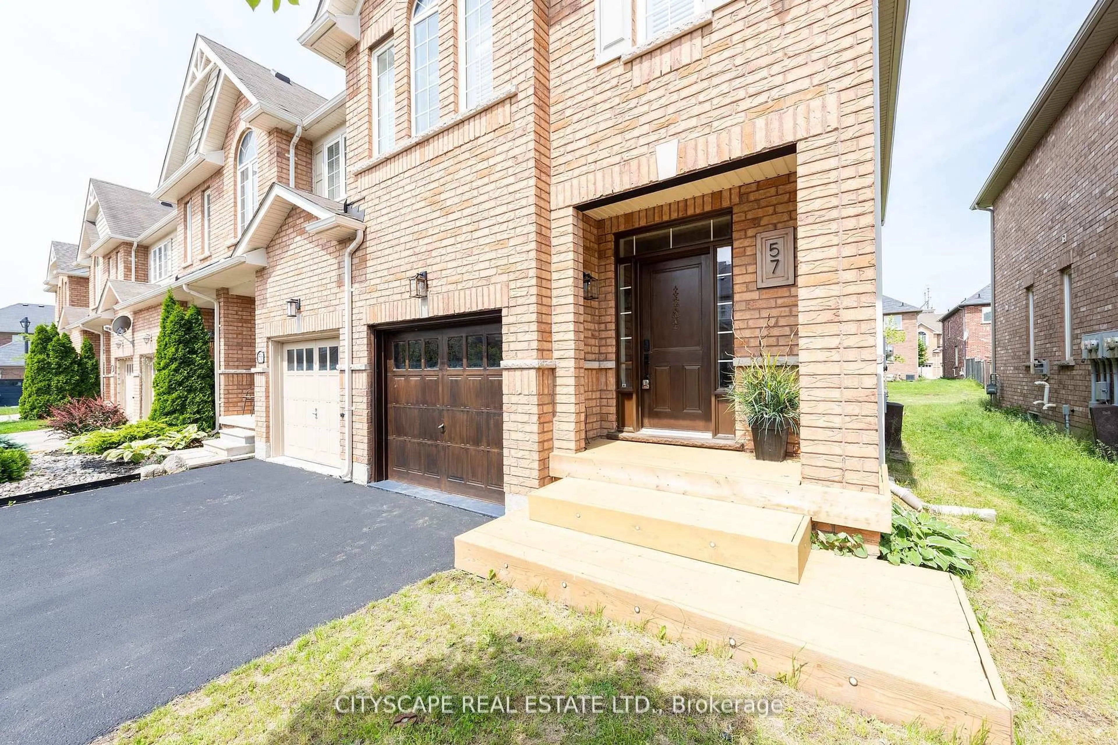 Home with brick exterior material, street for 651 Farmstead Dr #57, Milton Ontario L9T 7W2