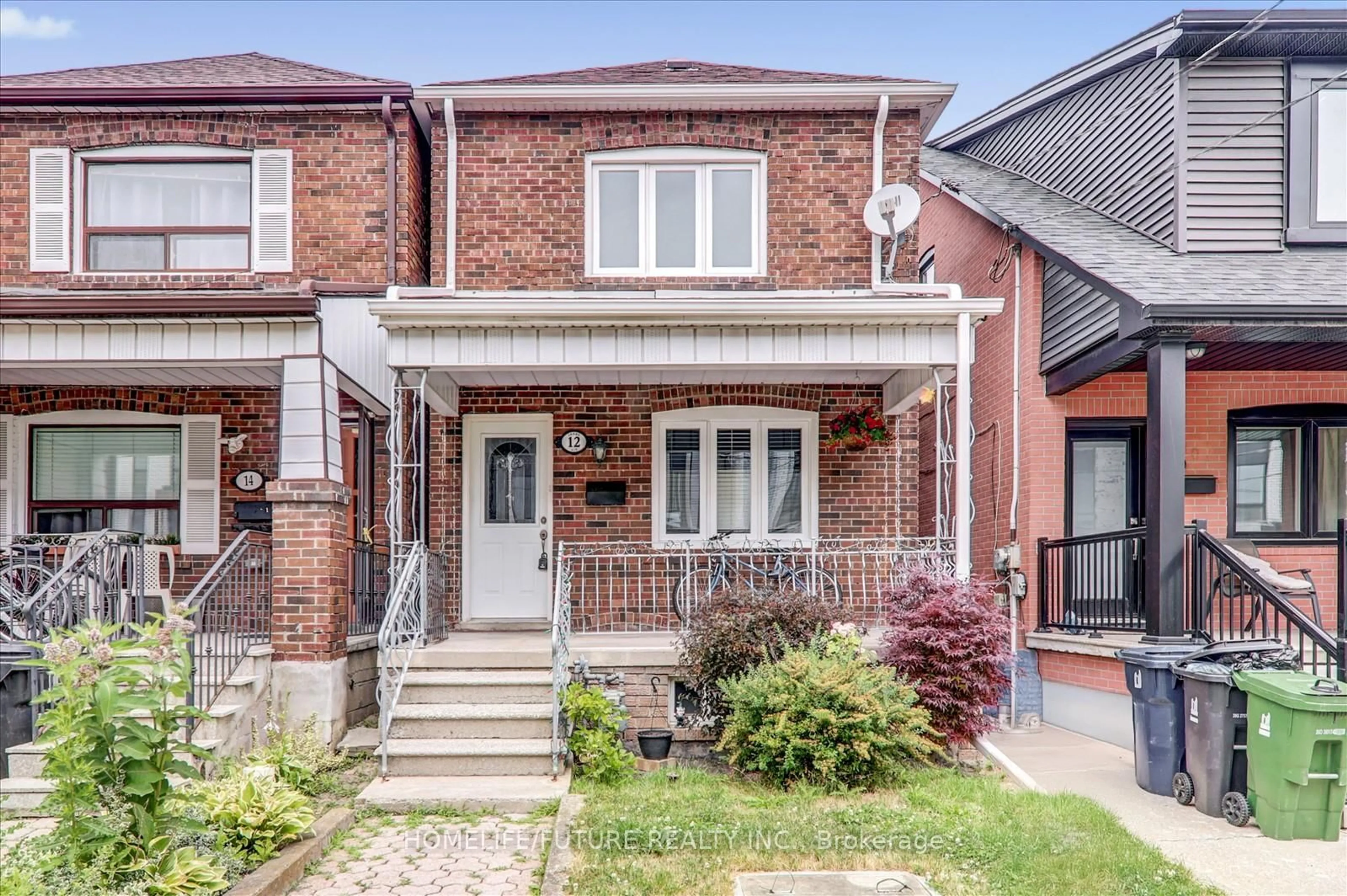 Home with brick exterior material, street for 12 Innes Ave, Toronto Ontario M6E 1M8